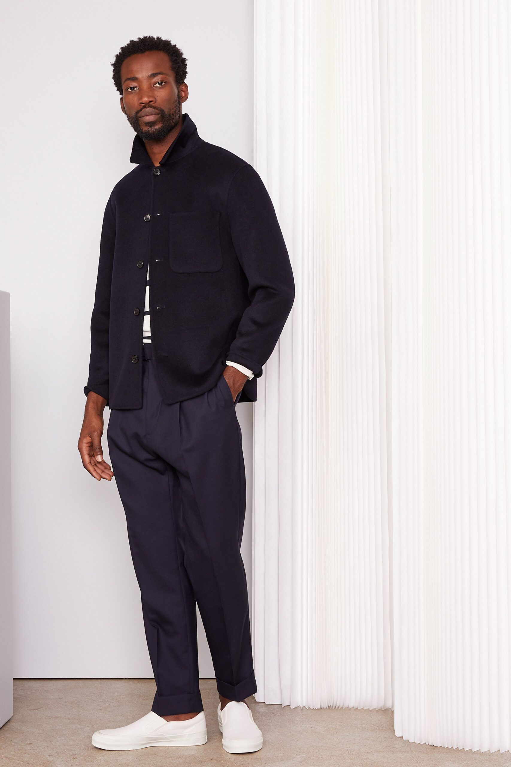 black relaxed jacket with navy pants