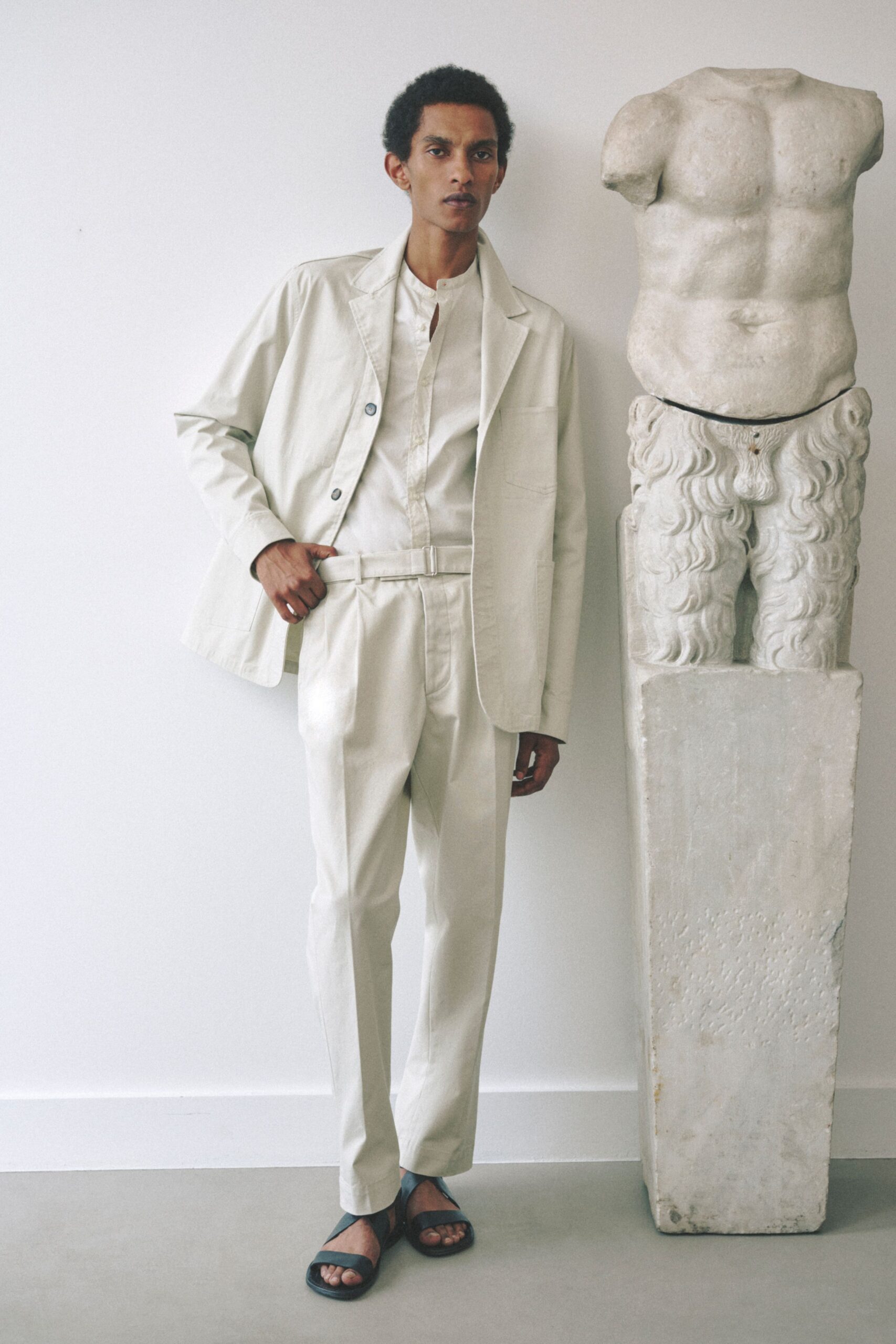 white tailored suit with black shoes