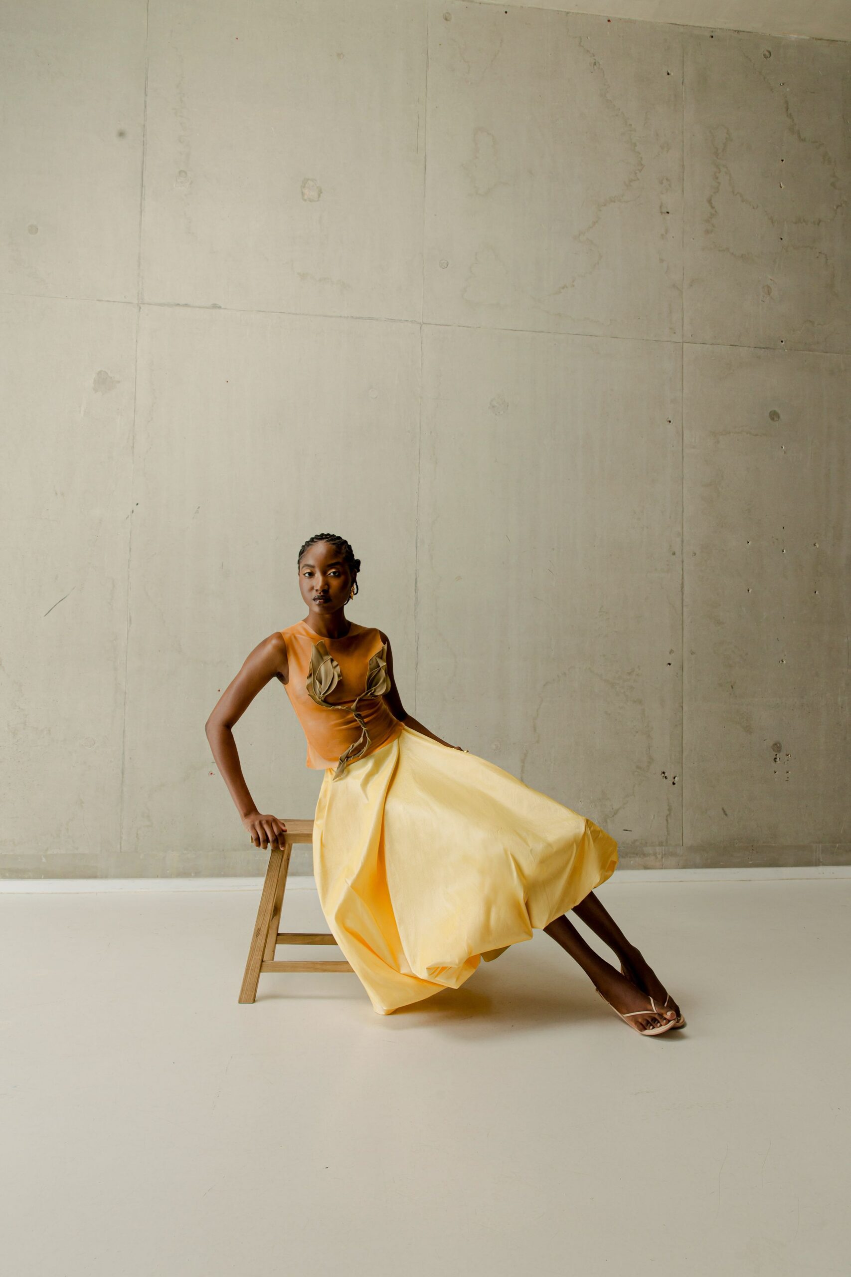 yellow silk sleeveless v-neck fitted pleated draped dress