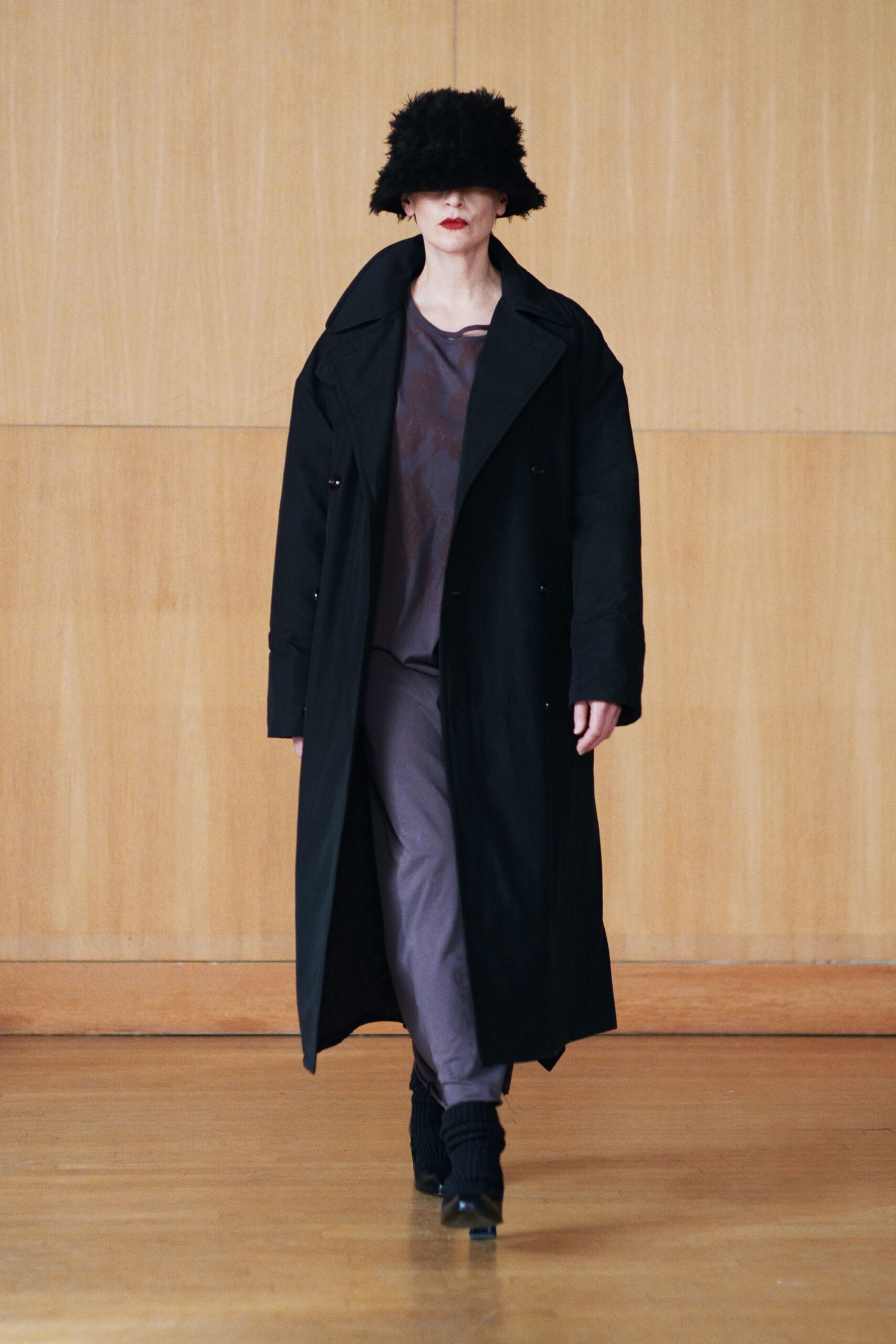 black coat gray top pants
