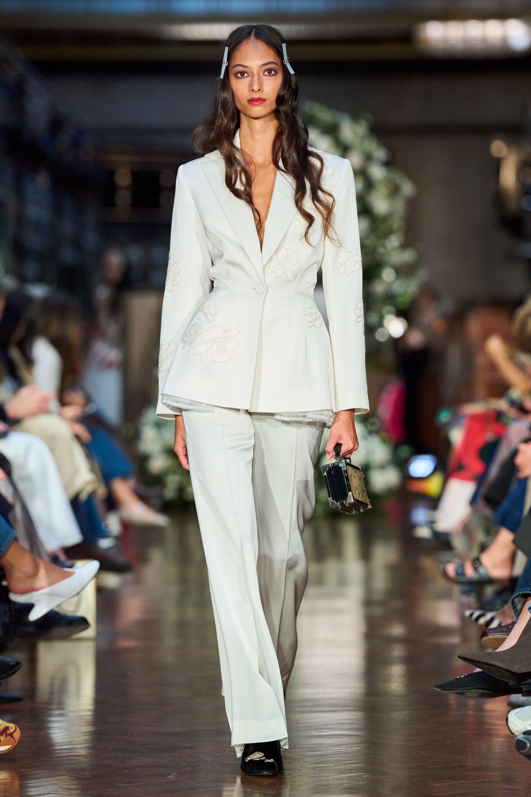 white tailored suit with black accessories