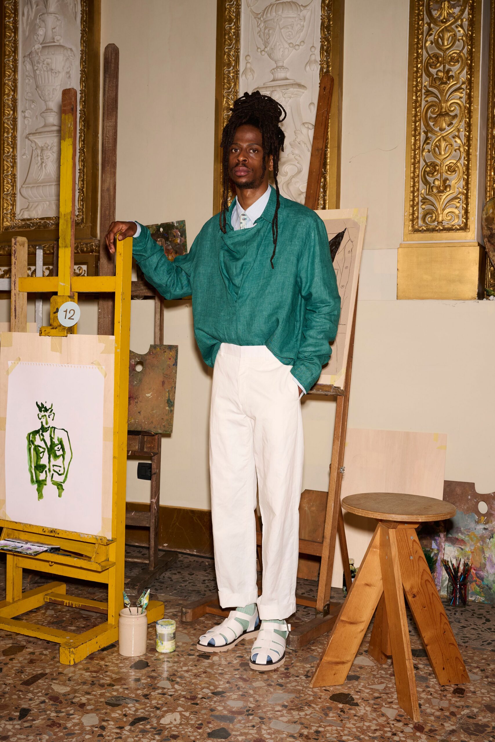 green relaxed top with white pants