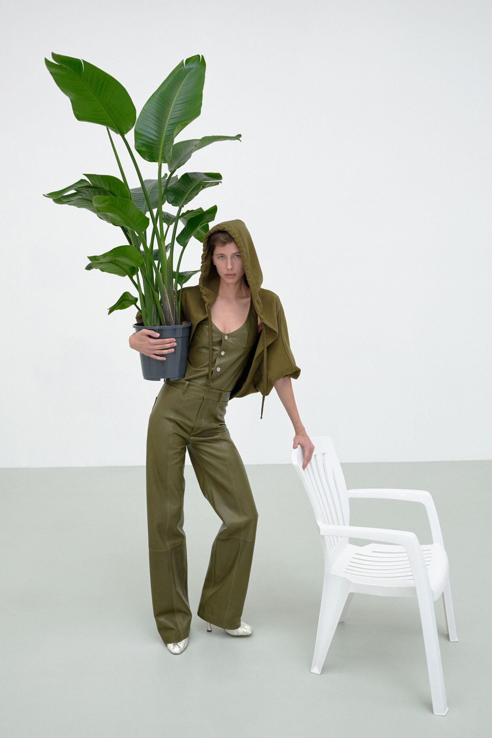 green cotton sleeveless hooded fitted zippered jumpsuit