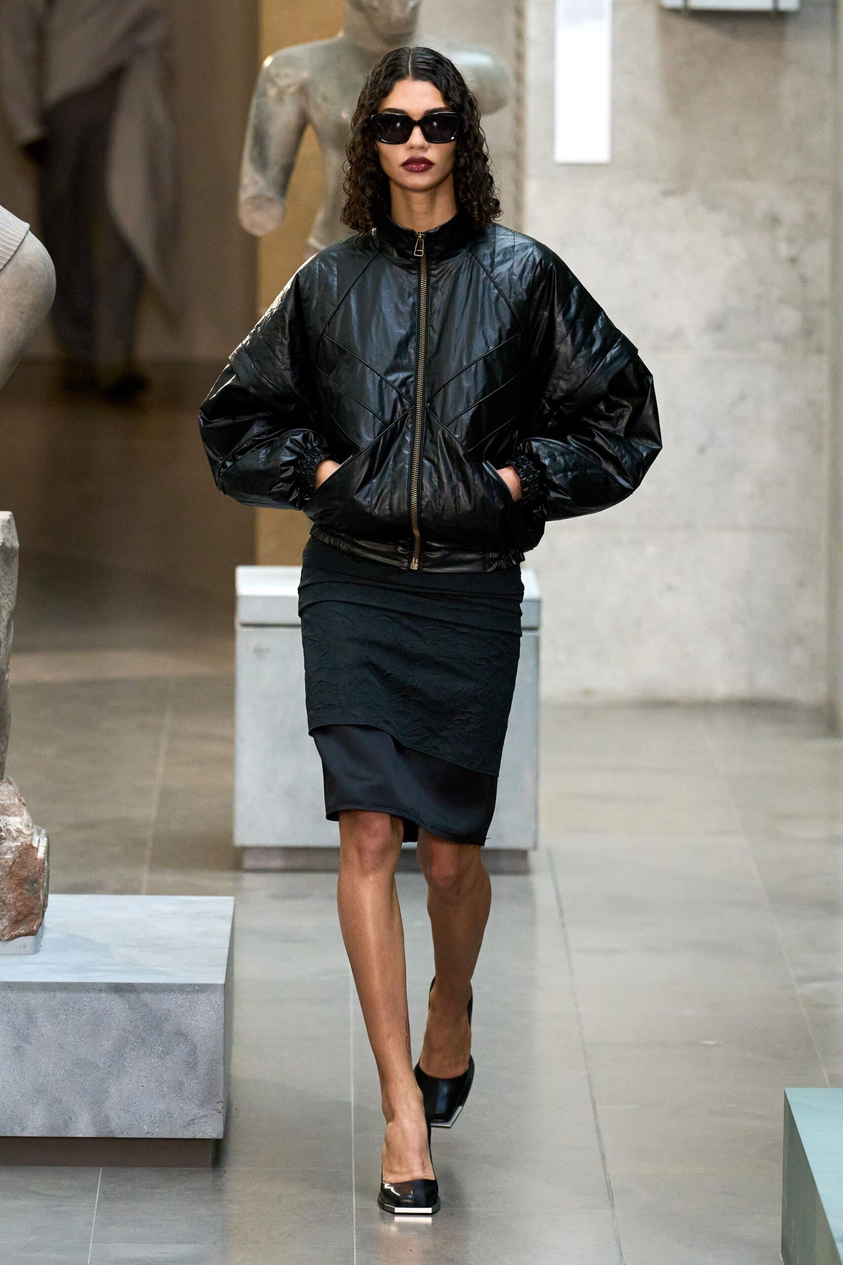 black vinyl long-sleeve collared relaxed zippered padded jacket