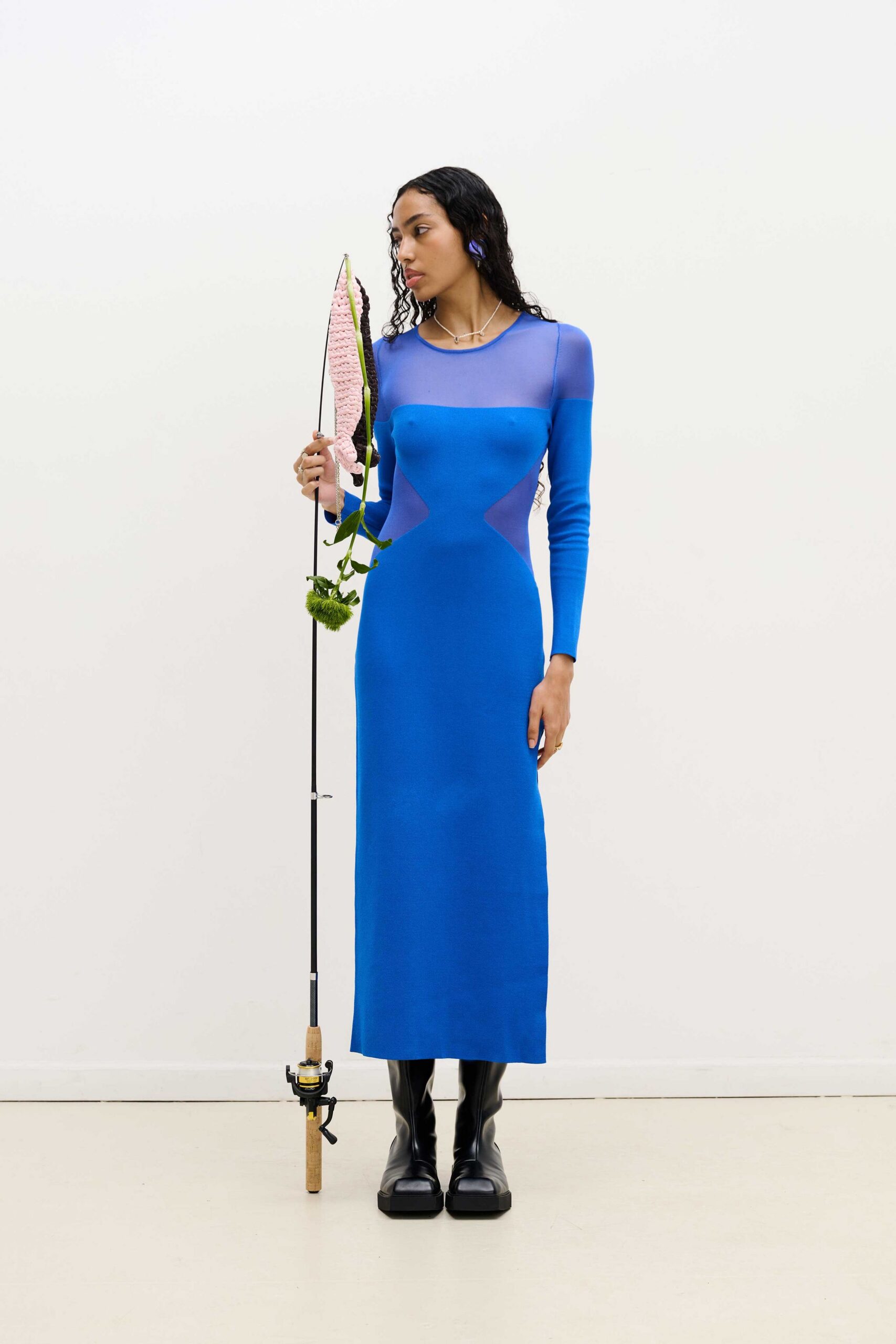 blue fitted long-sleeve dress with black boots
