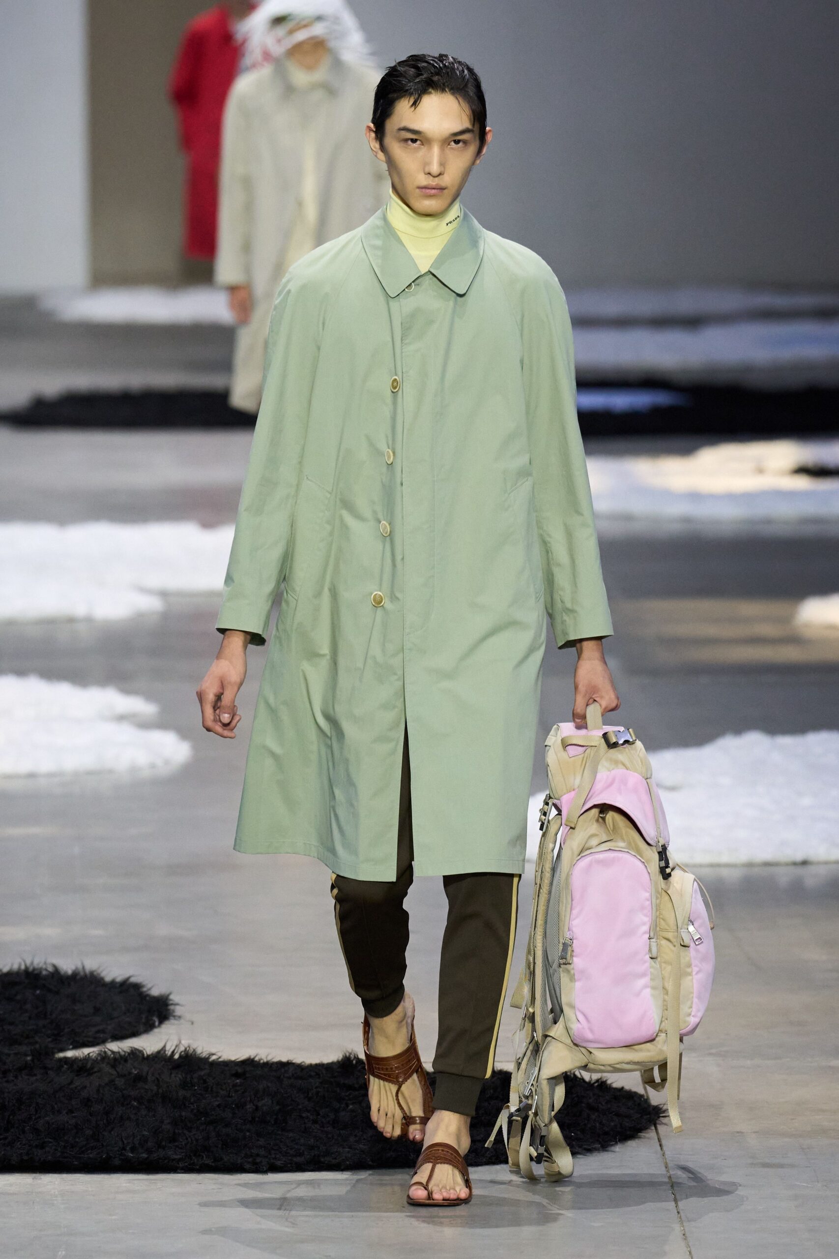 green coat brown pants sandals bag