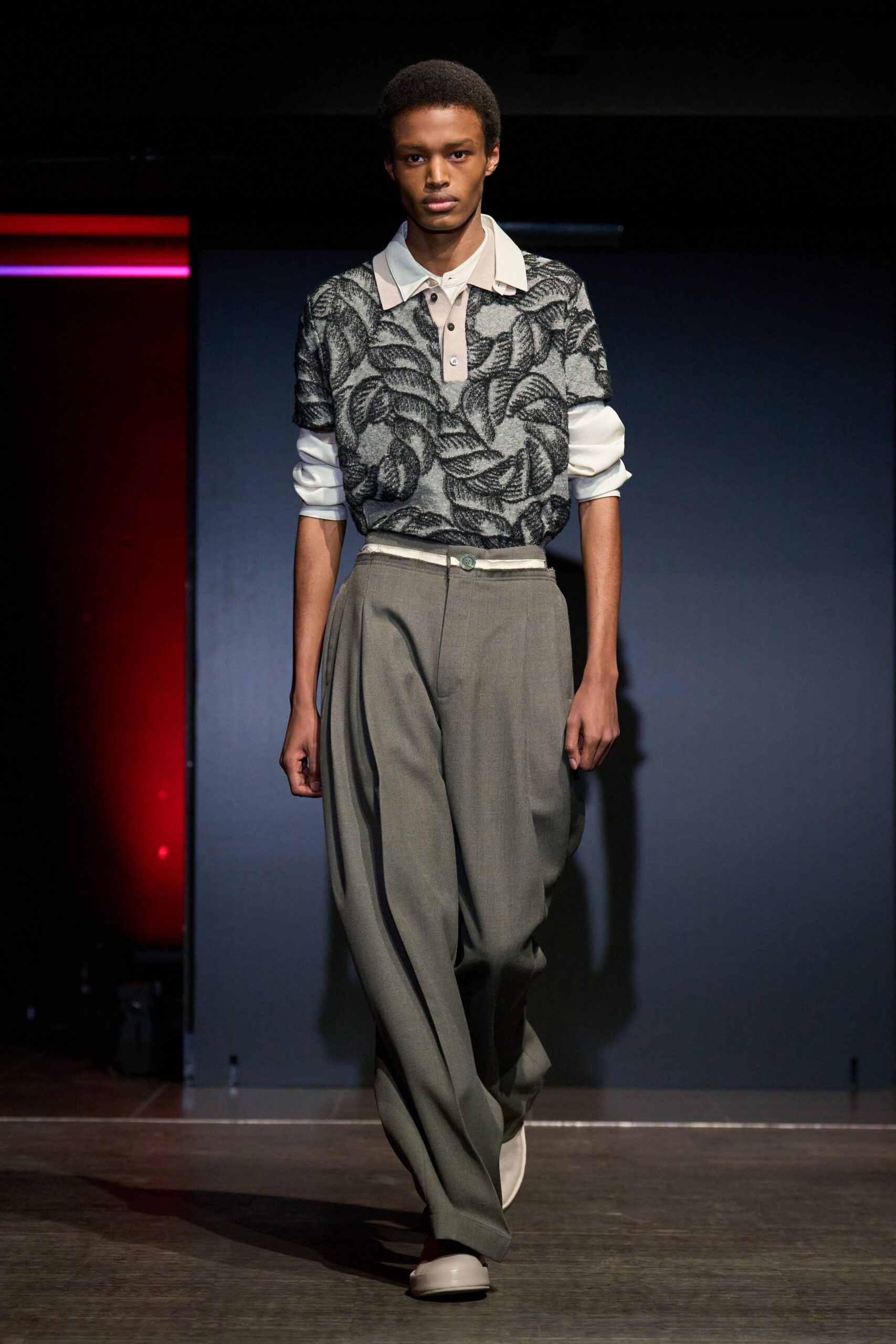 black and white printed shirt with gray tailored pants
