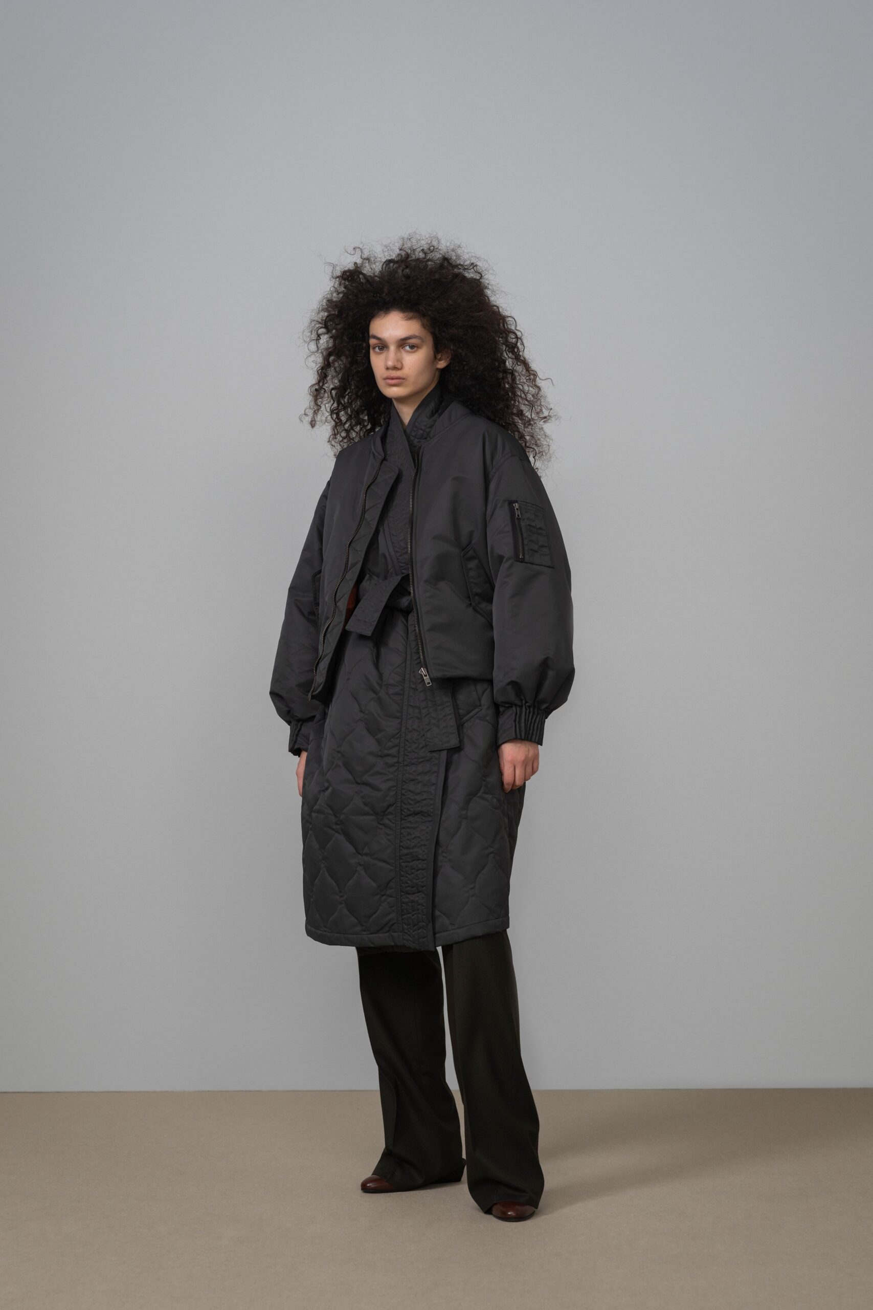 black cotton long-sleeve collared relaxed zippered padded jacket