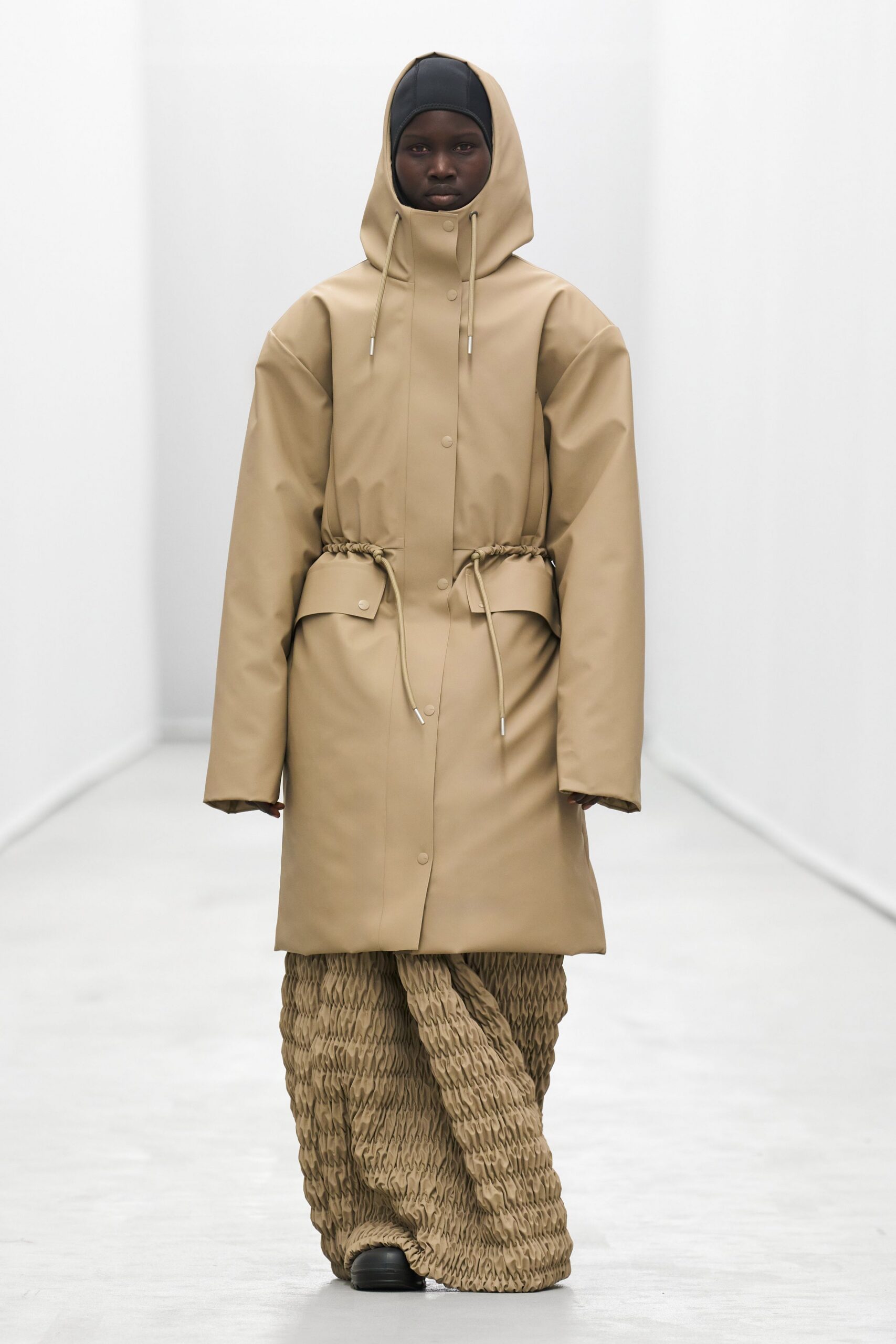 beige vinyl long-sleeve hooded relaxed zippered belted coat