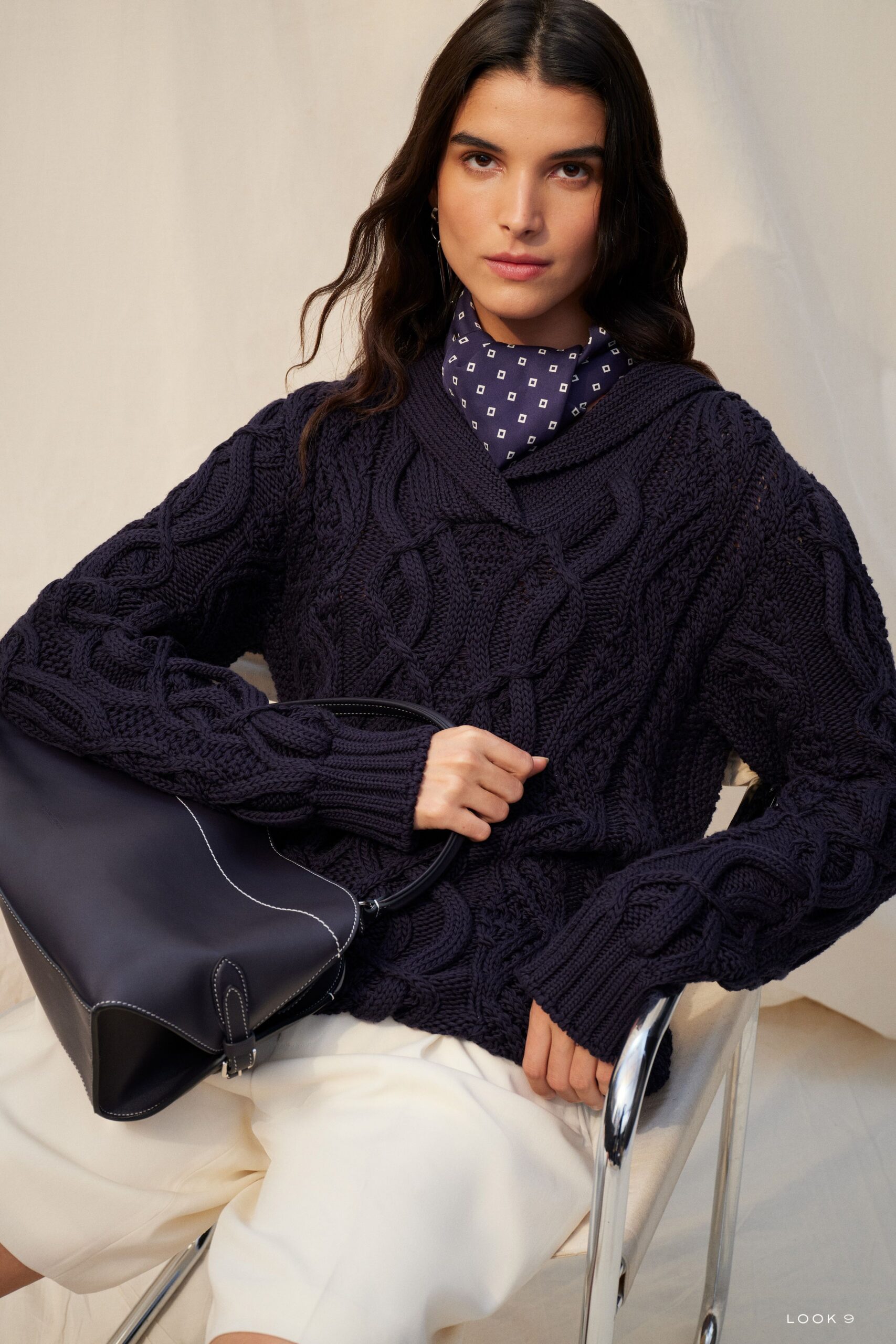 navy knitted sweater with white shorts