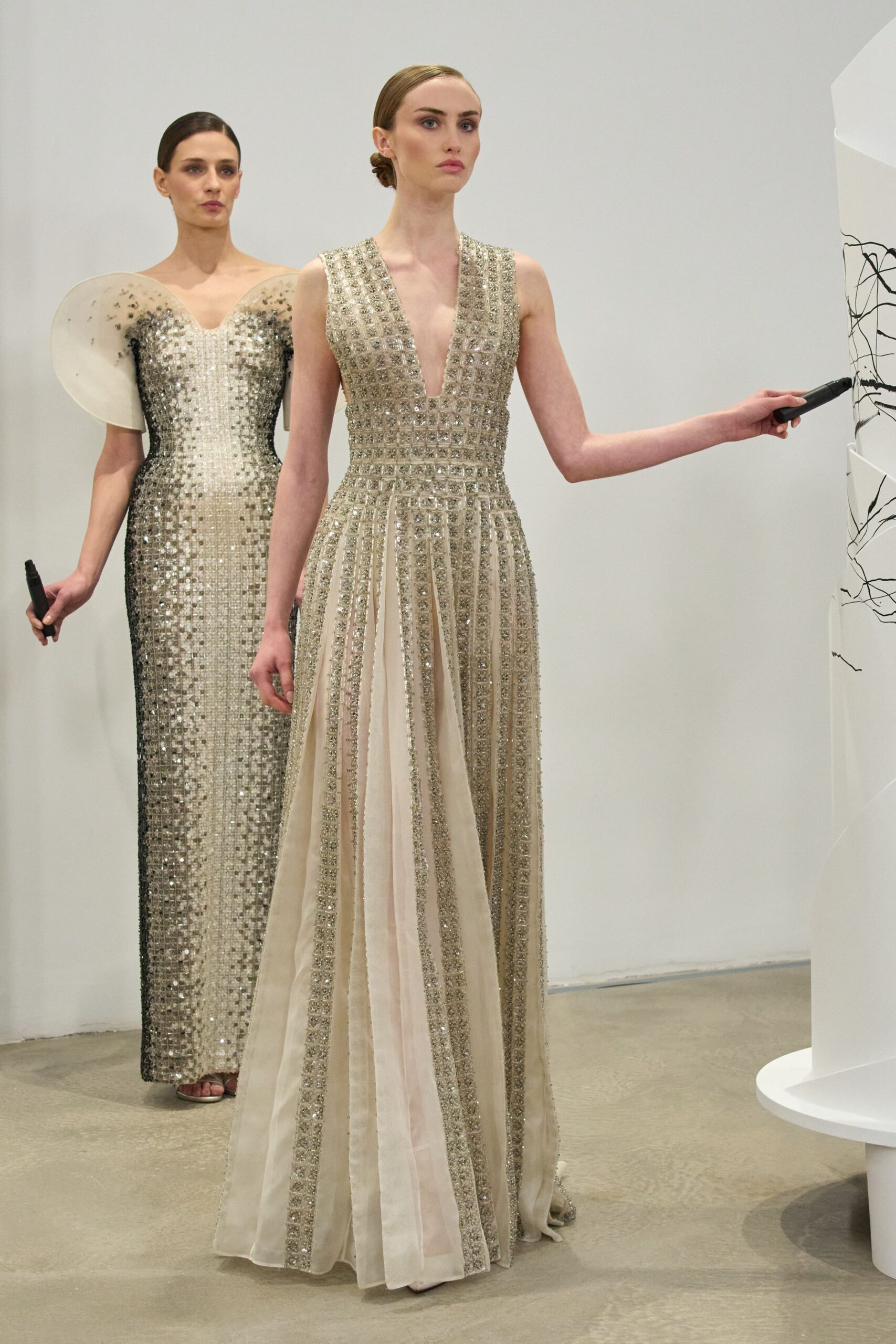 beige silk sleeveless v-neck fitted embellished pleated gown