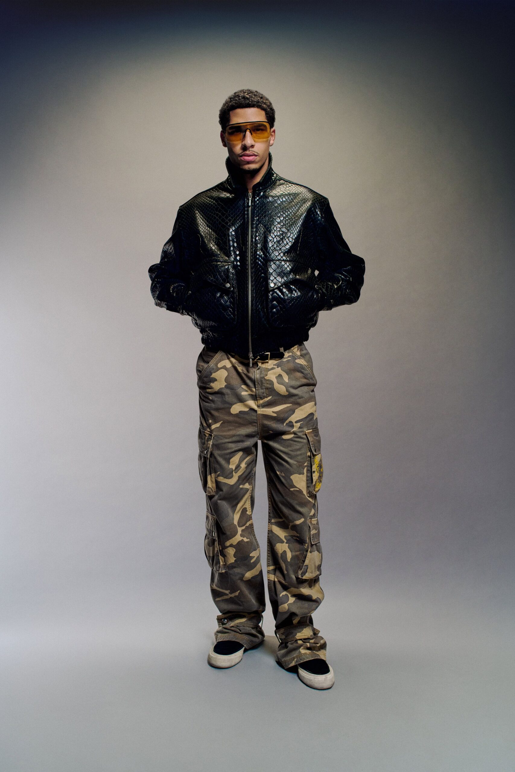 black leather jacket with camouflage pants