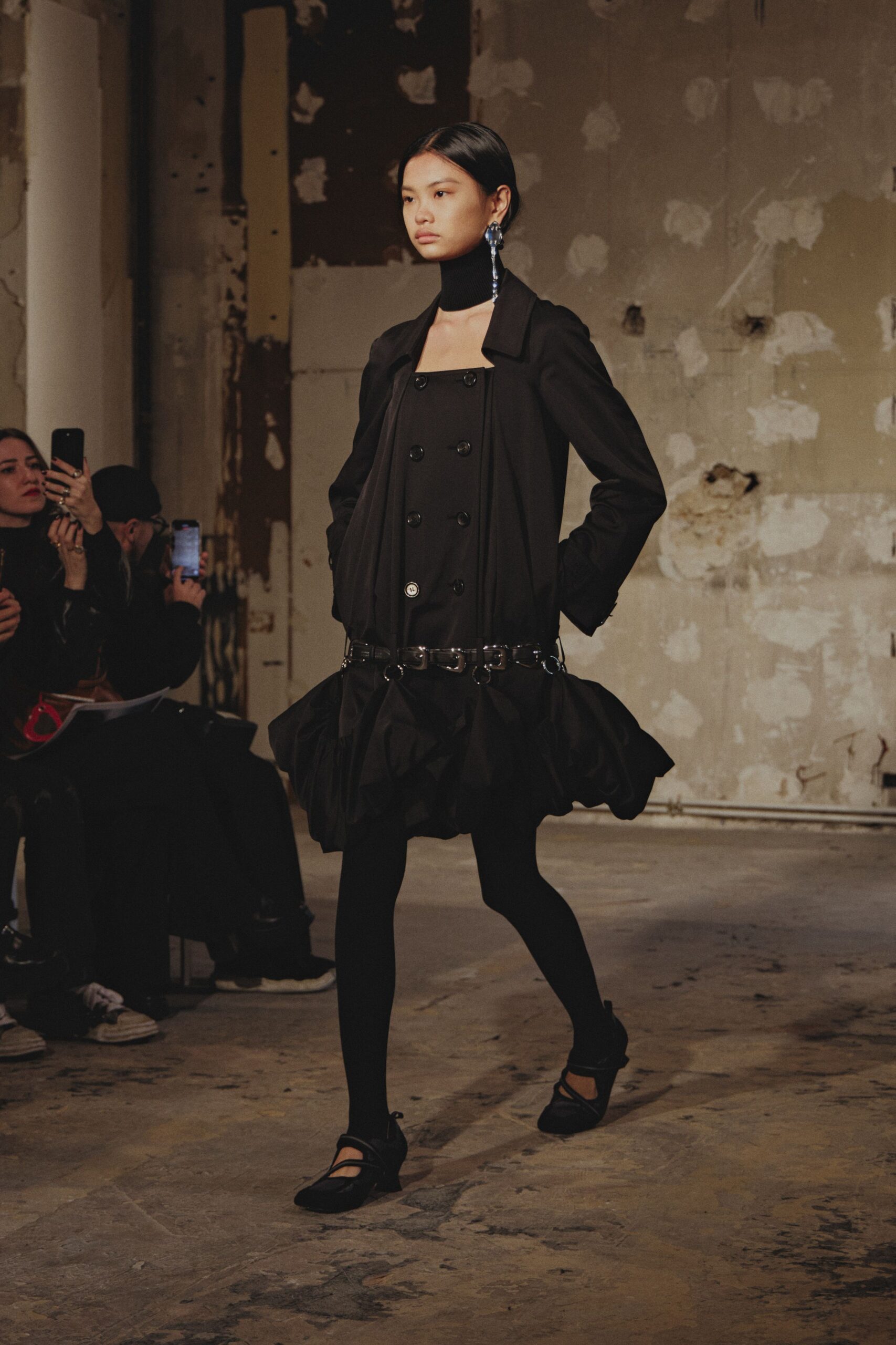 black cotton long-sleeve collared structured buttoned coat