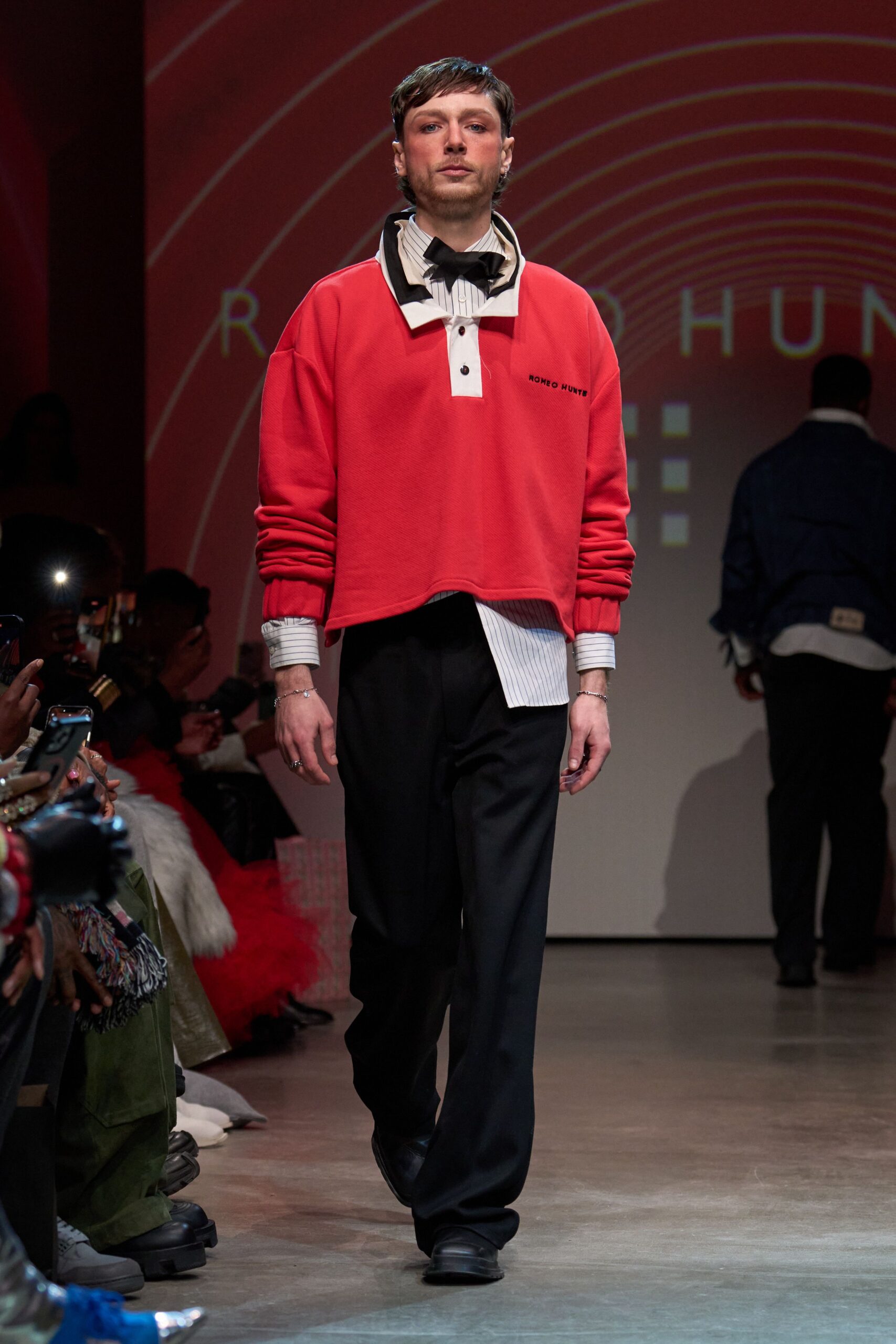red relaxed top with black pants