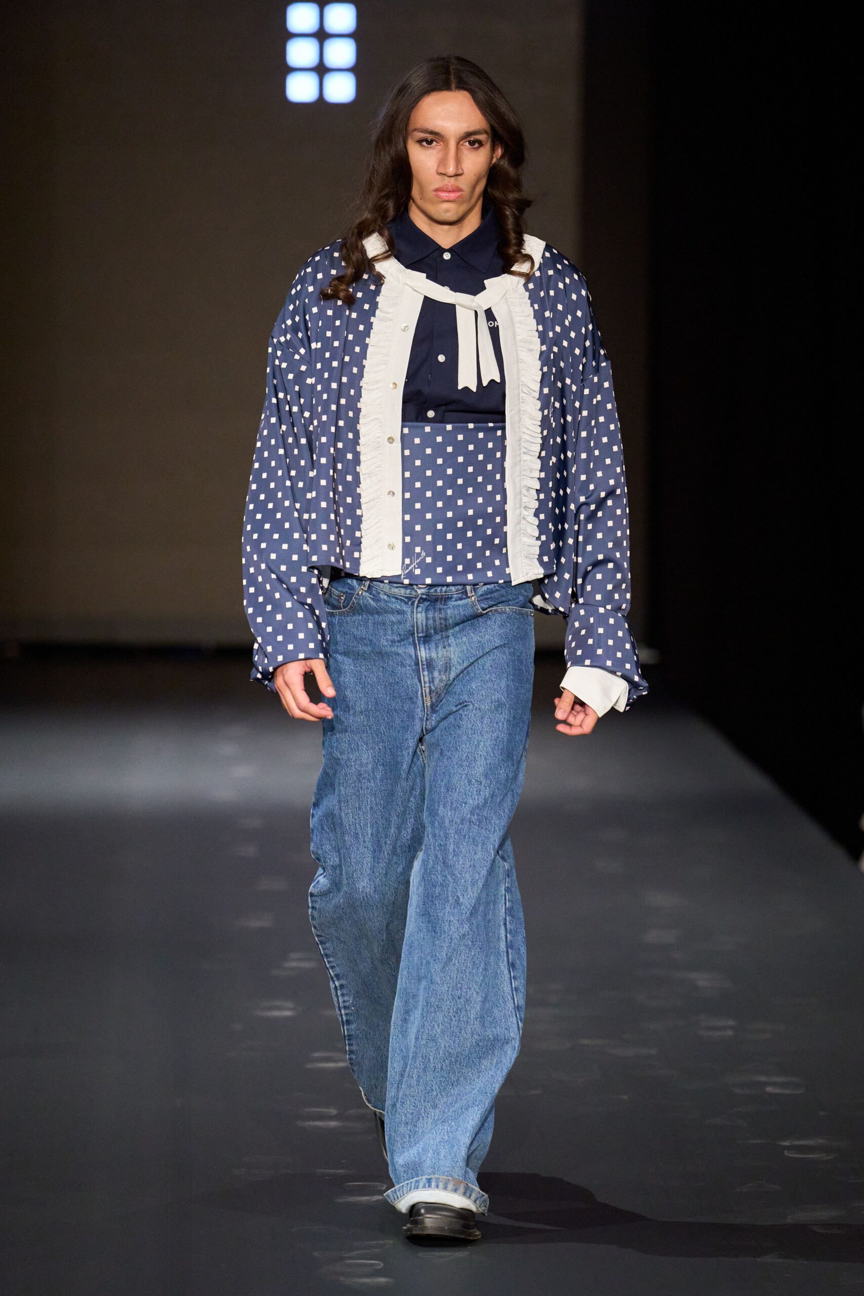blue polka-dot shirt and denim pants
