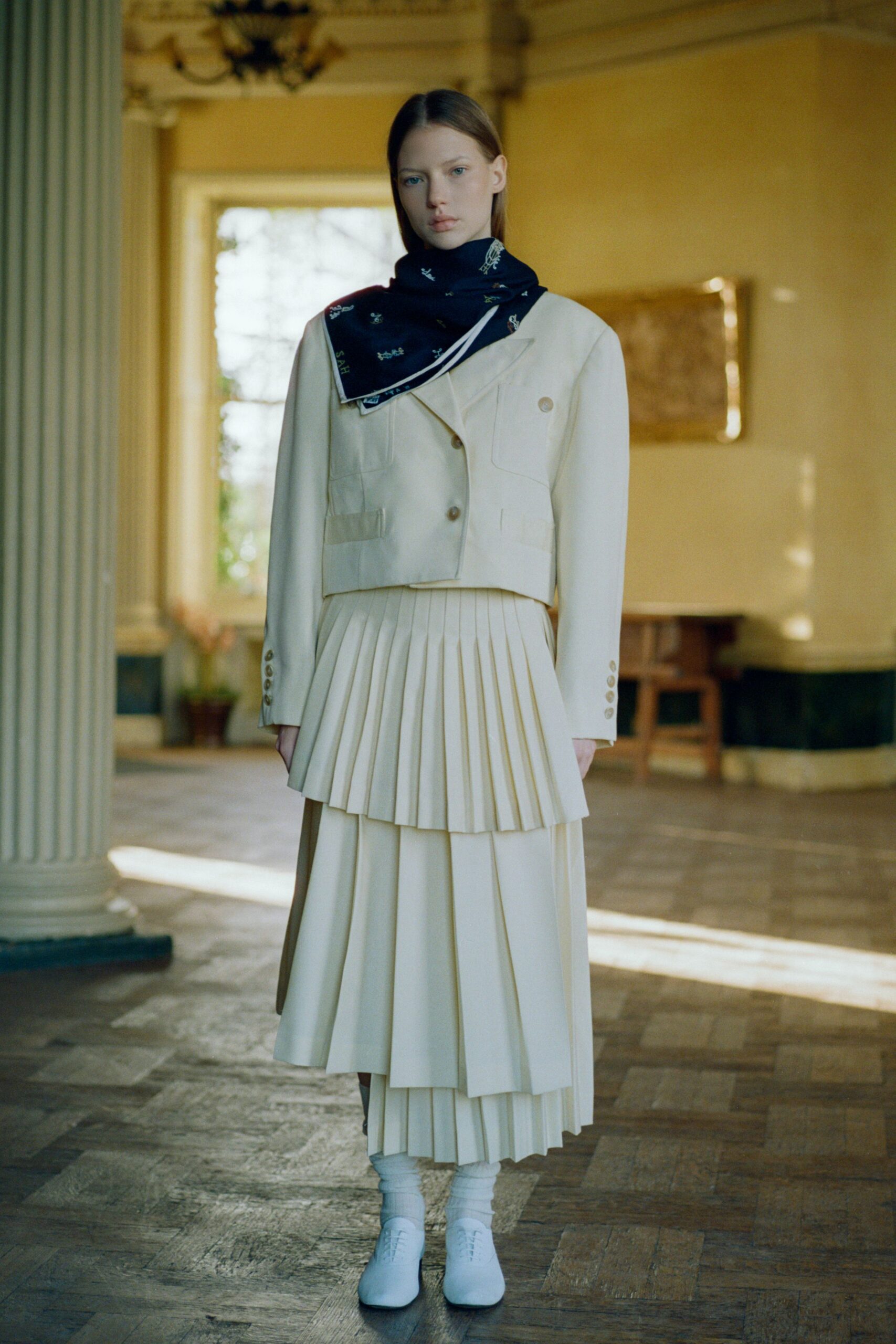 beige blazer and pleated skirt