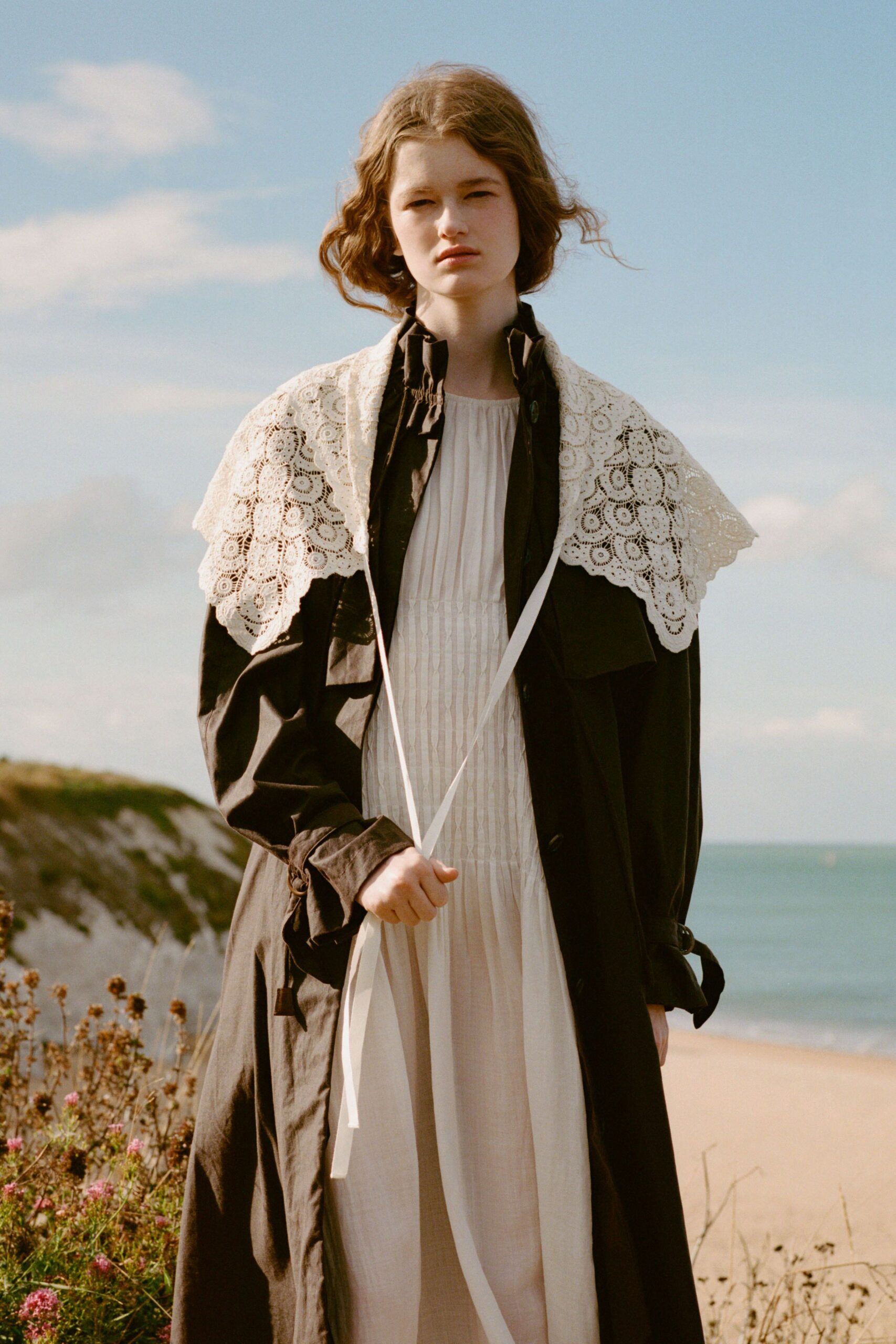 black coat over white dress