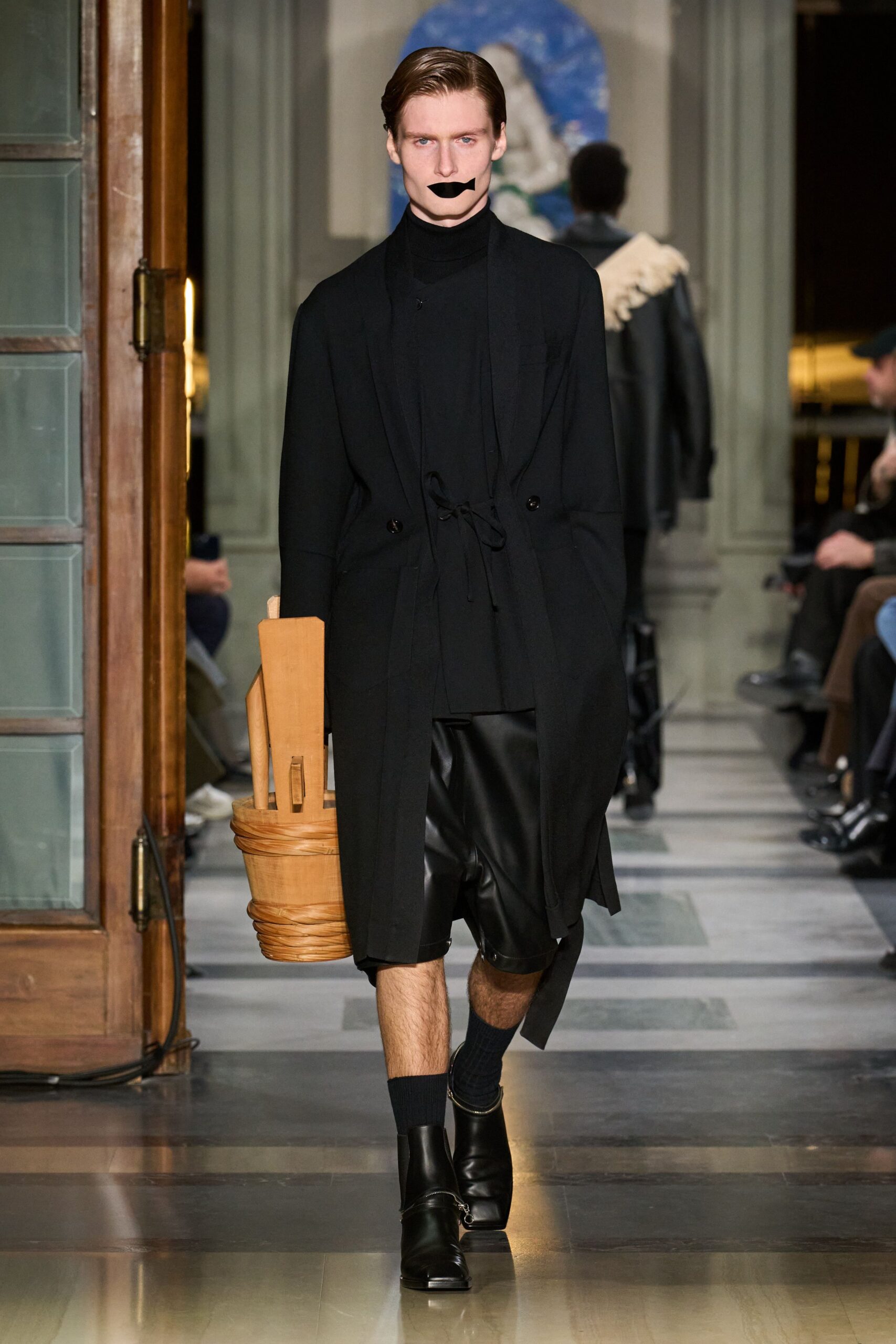 black coat with leather shorts