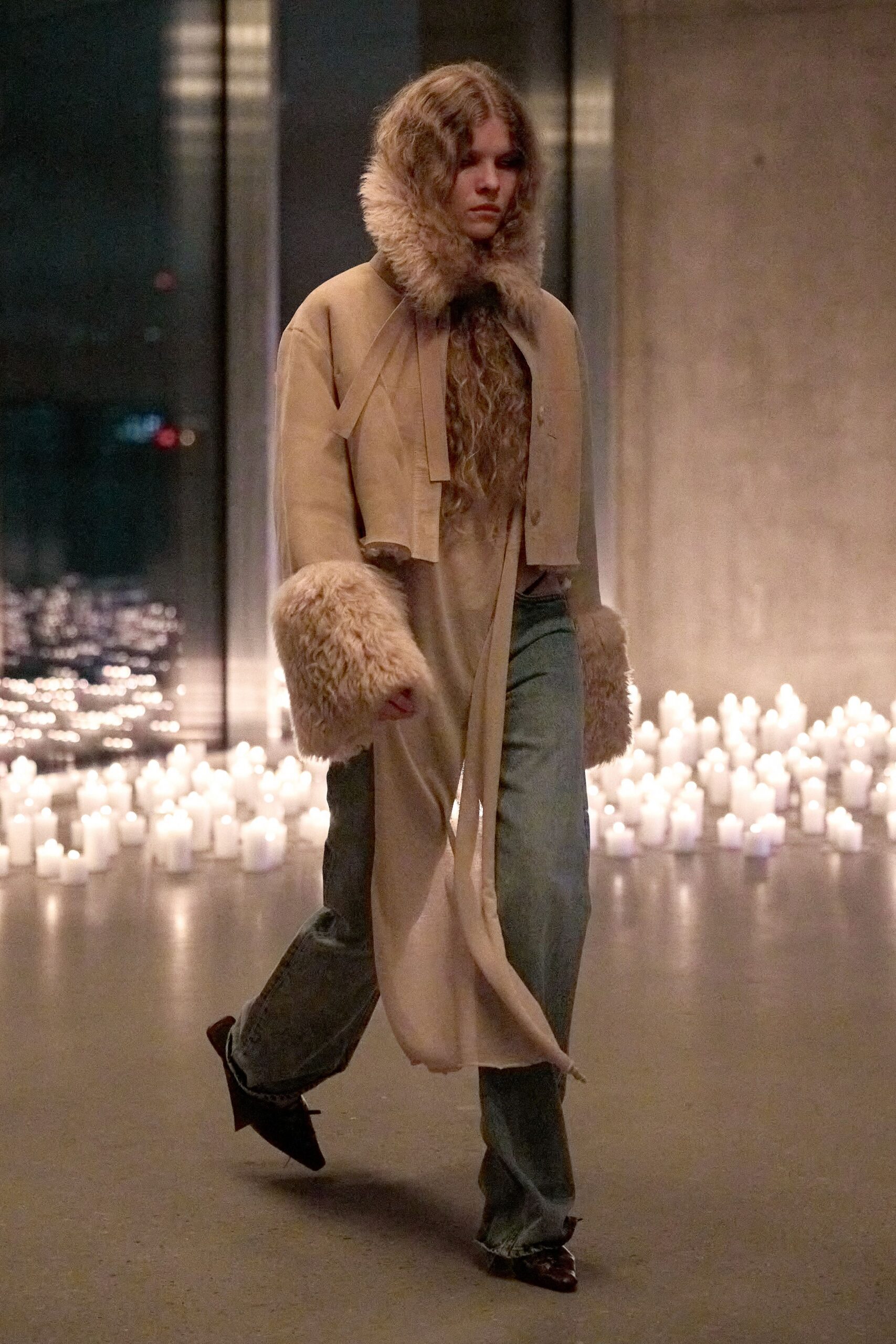 beige faux-fur coat with blue denim pants