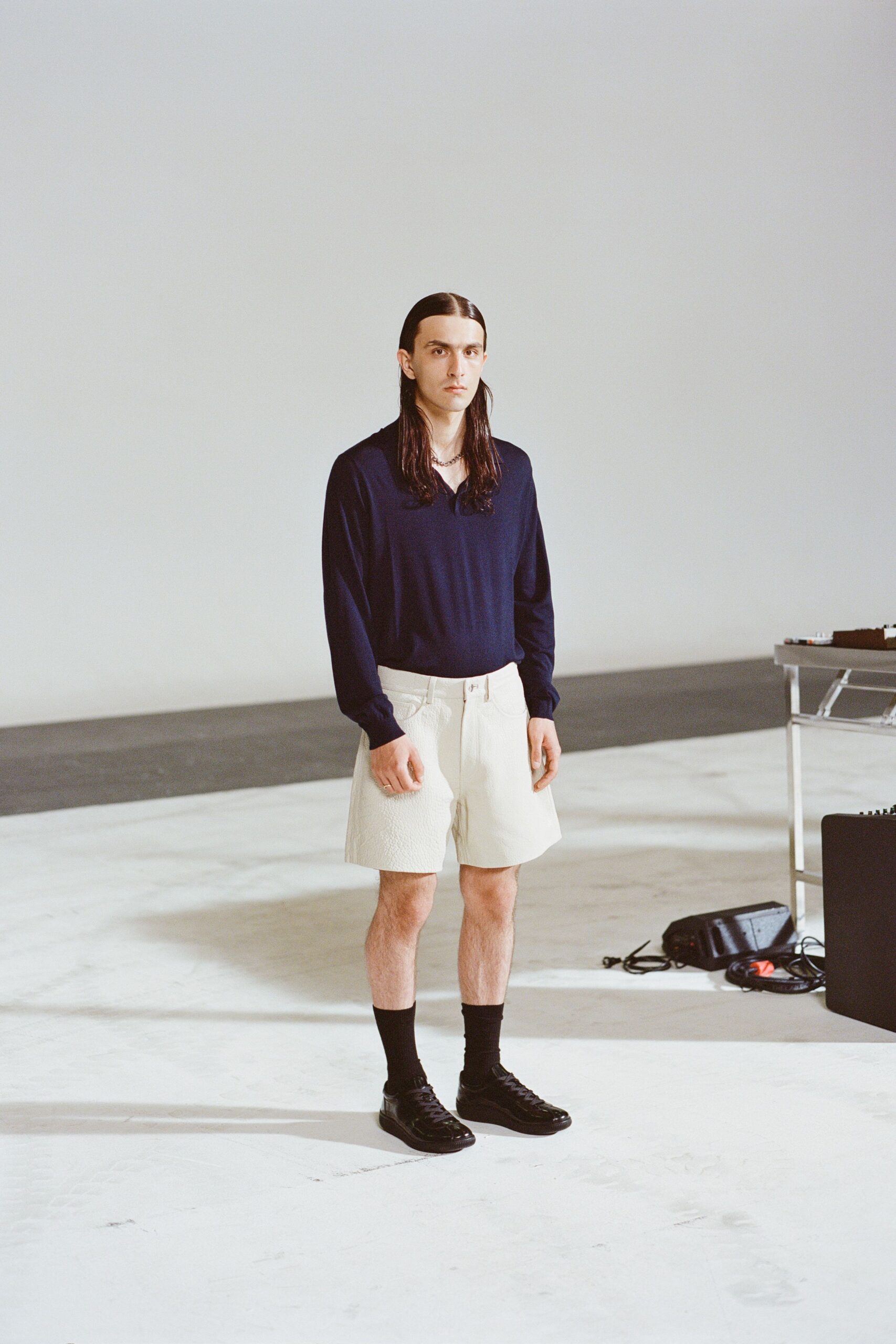 navy shirt beige shorts outfit