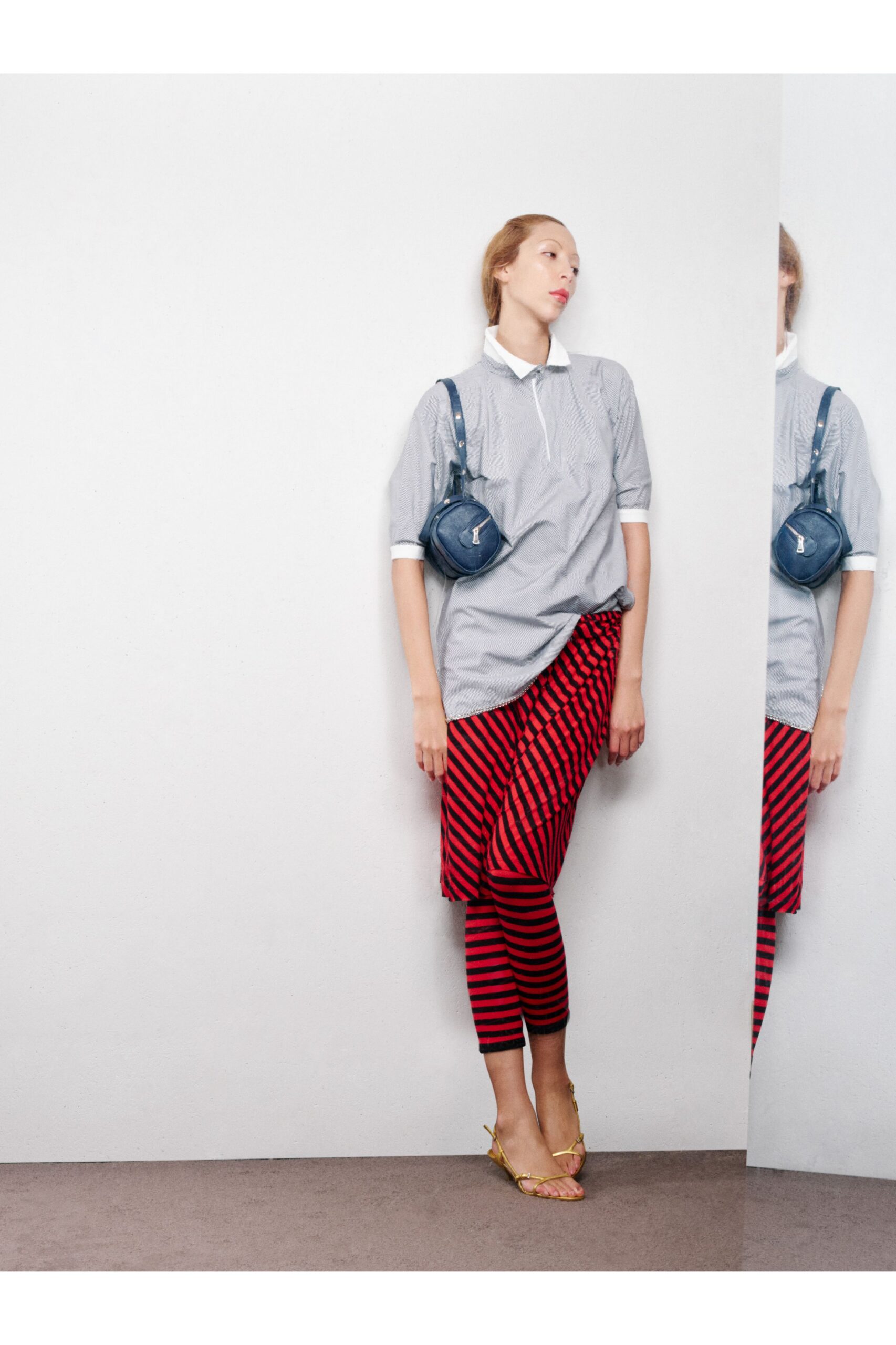 gray shirt red striped skirt