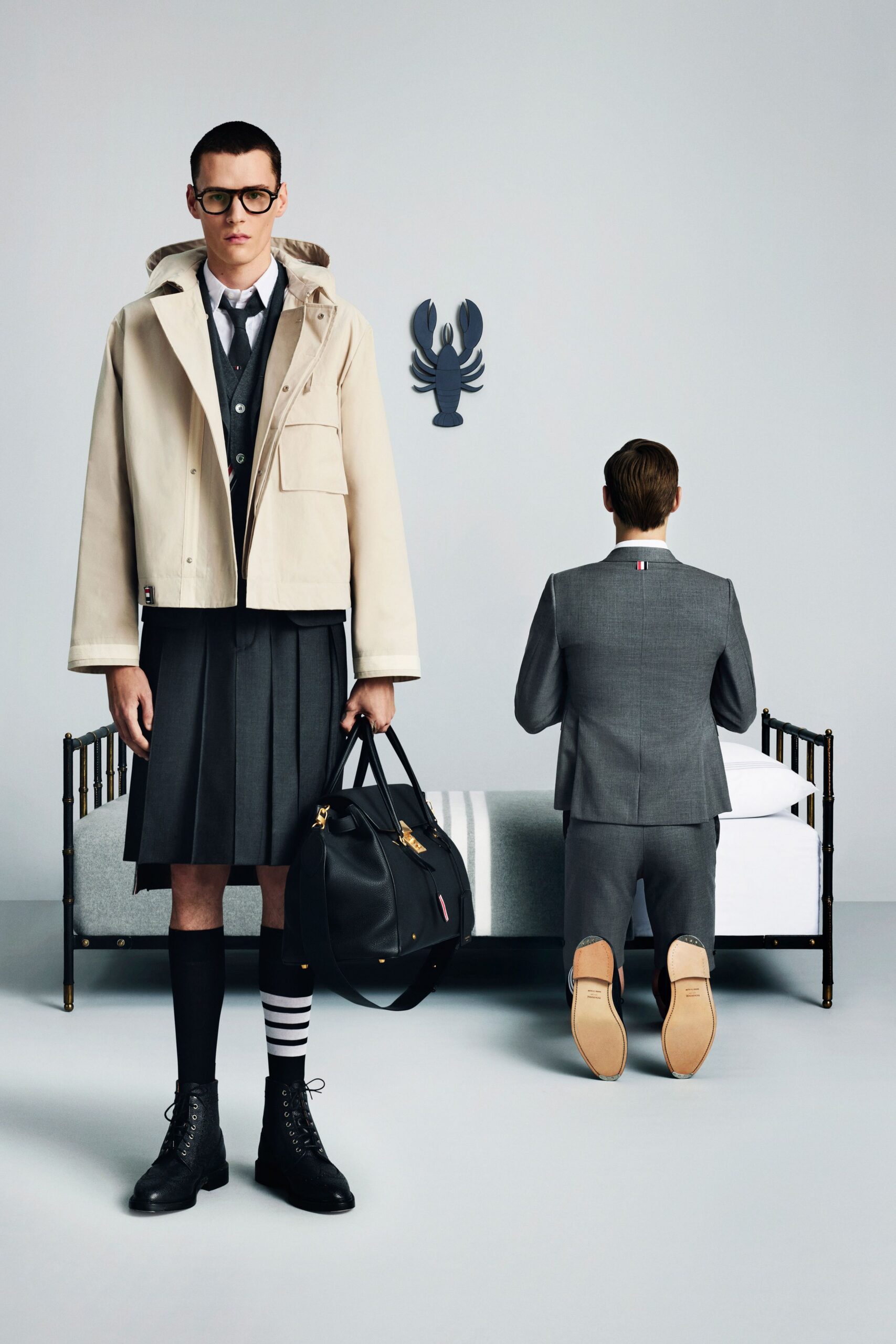 beige coat gray sweater black skirt
