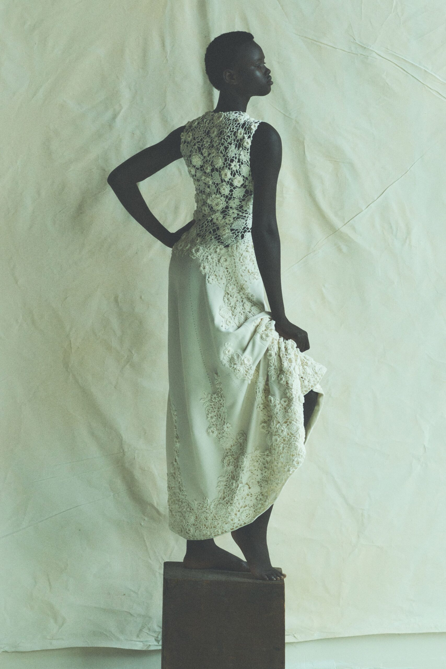 white embroidered sleeveless gown