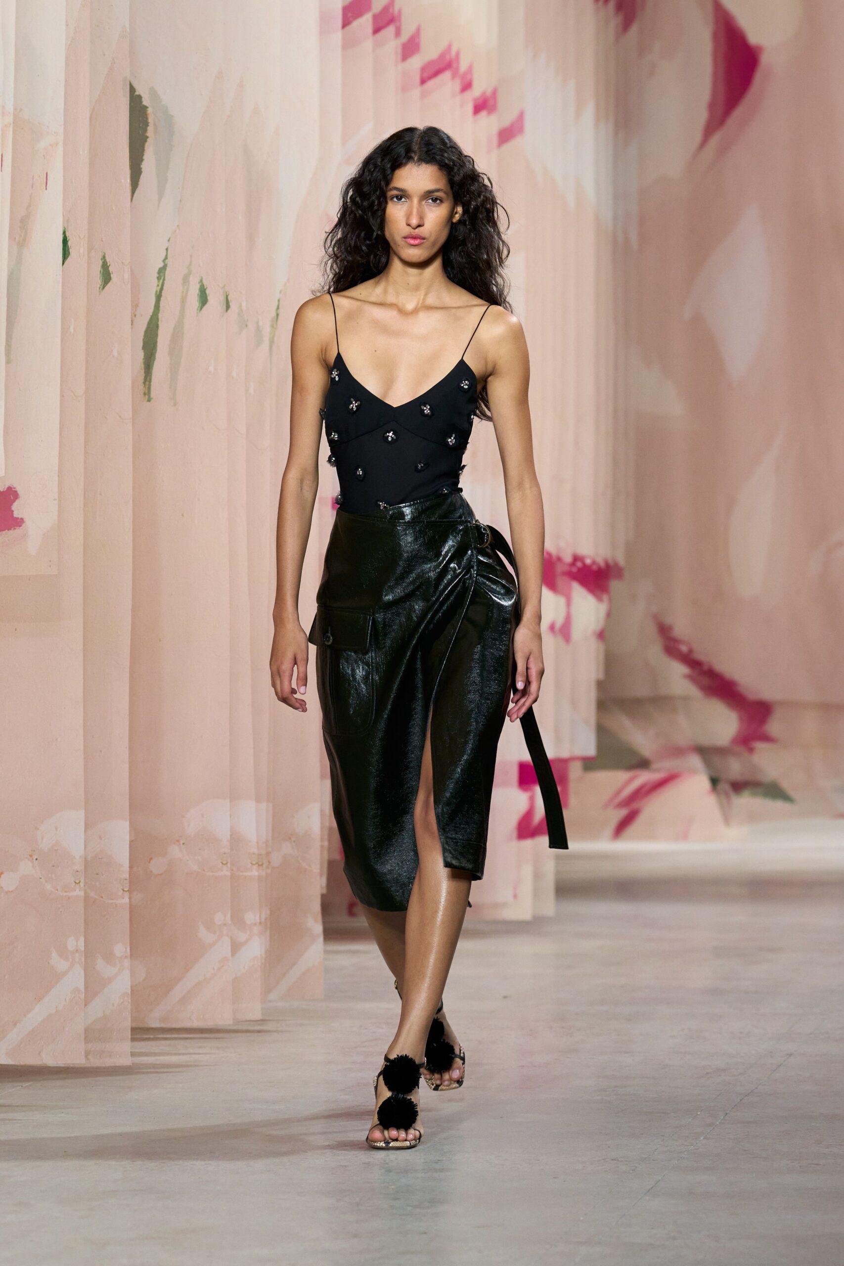 black silk bodysuit and leather skirt