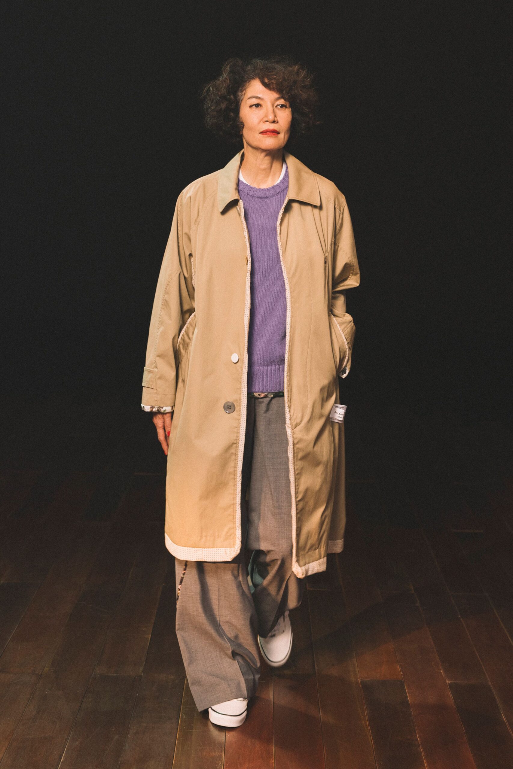 beige coat purple sweater gray pants