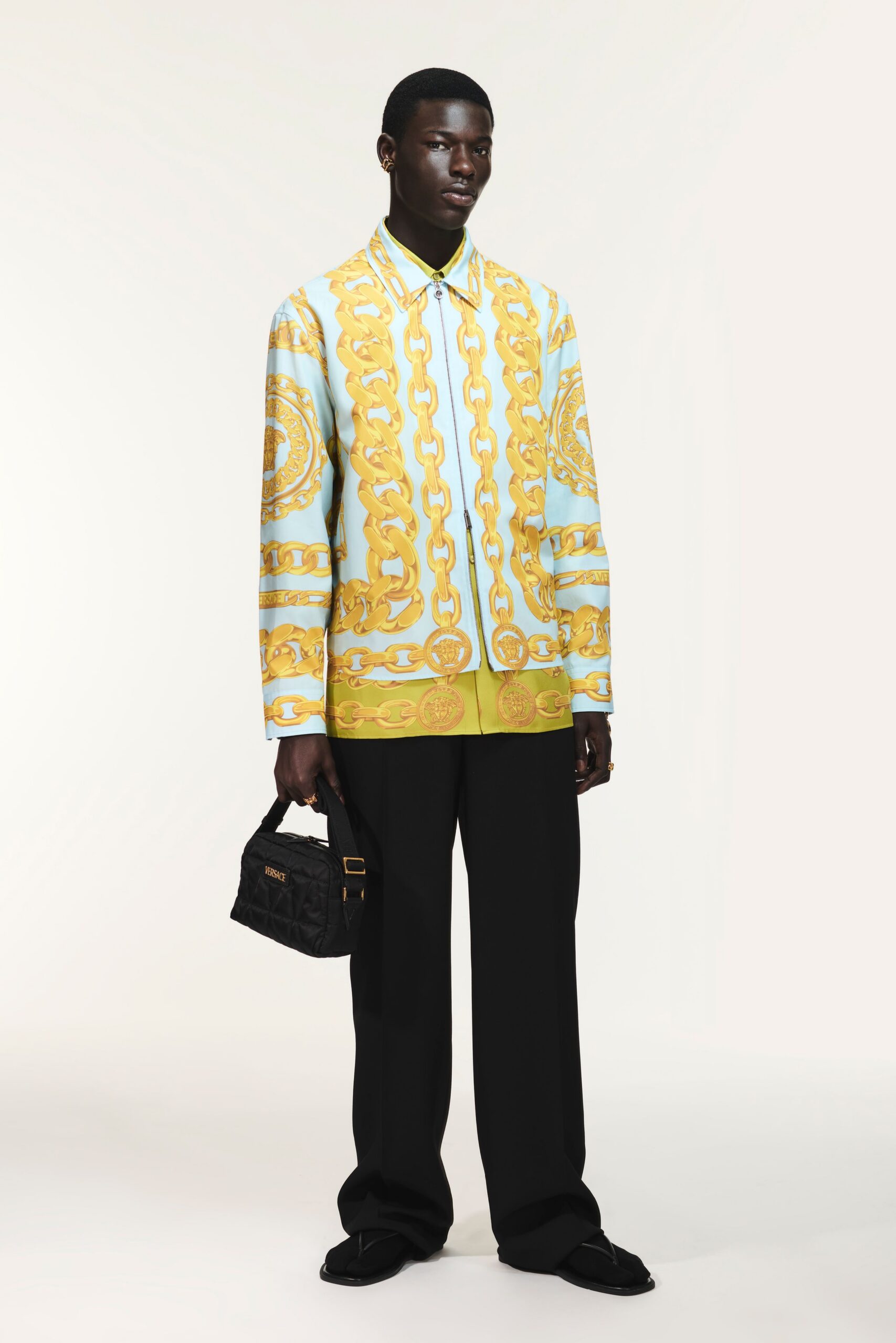 blue yellow printed shirt with black pants