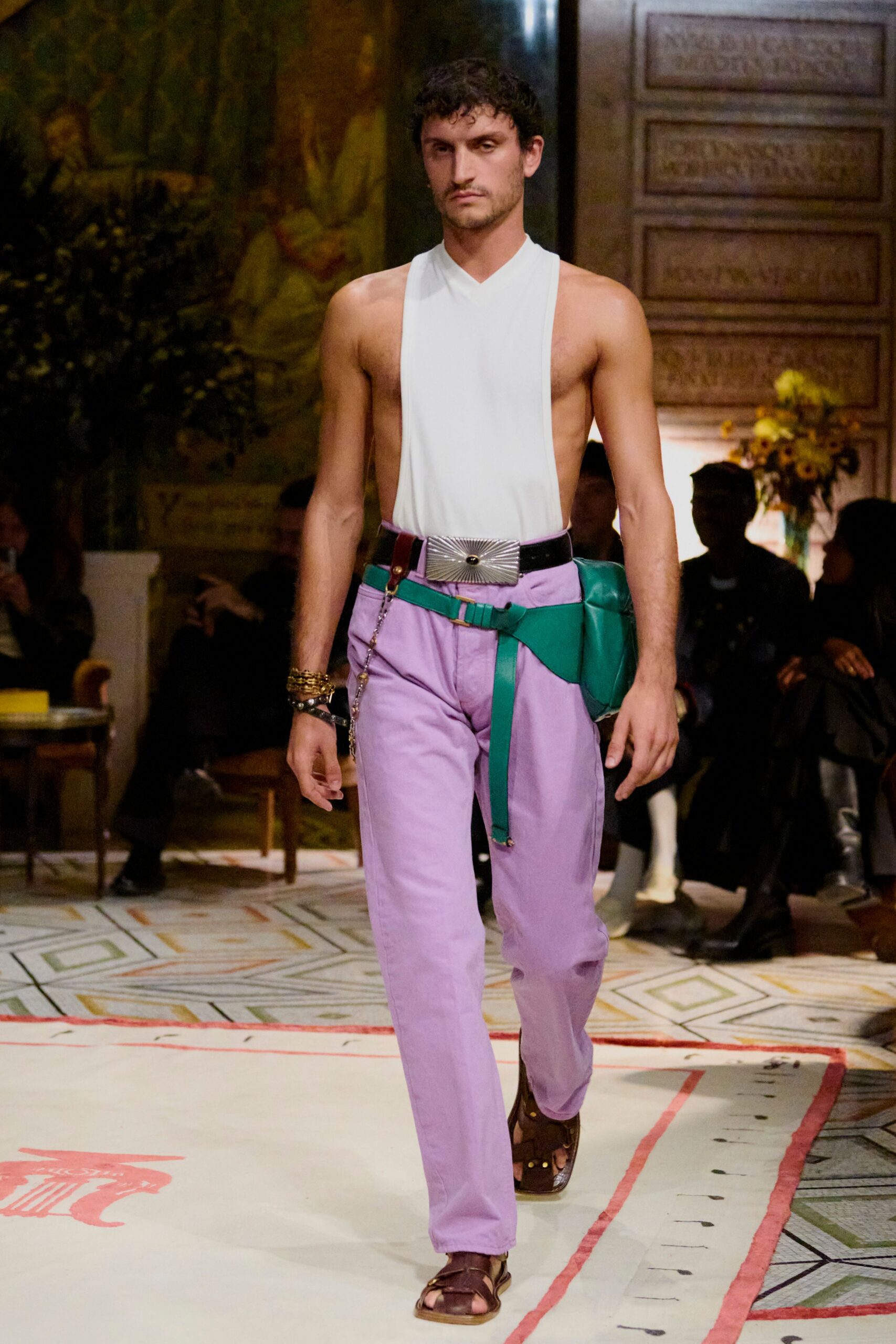 white sleeveless top with purple pants