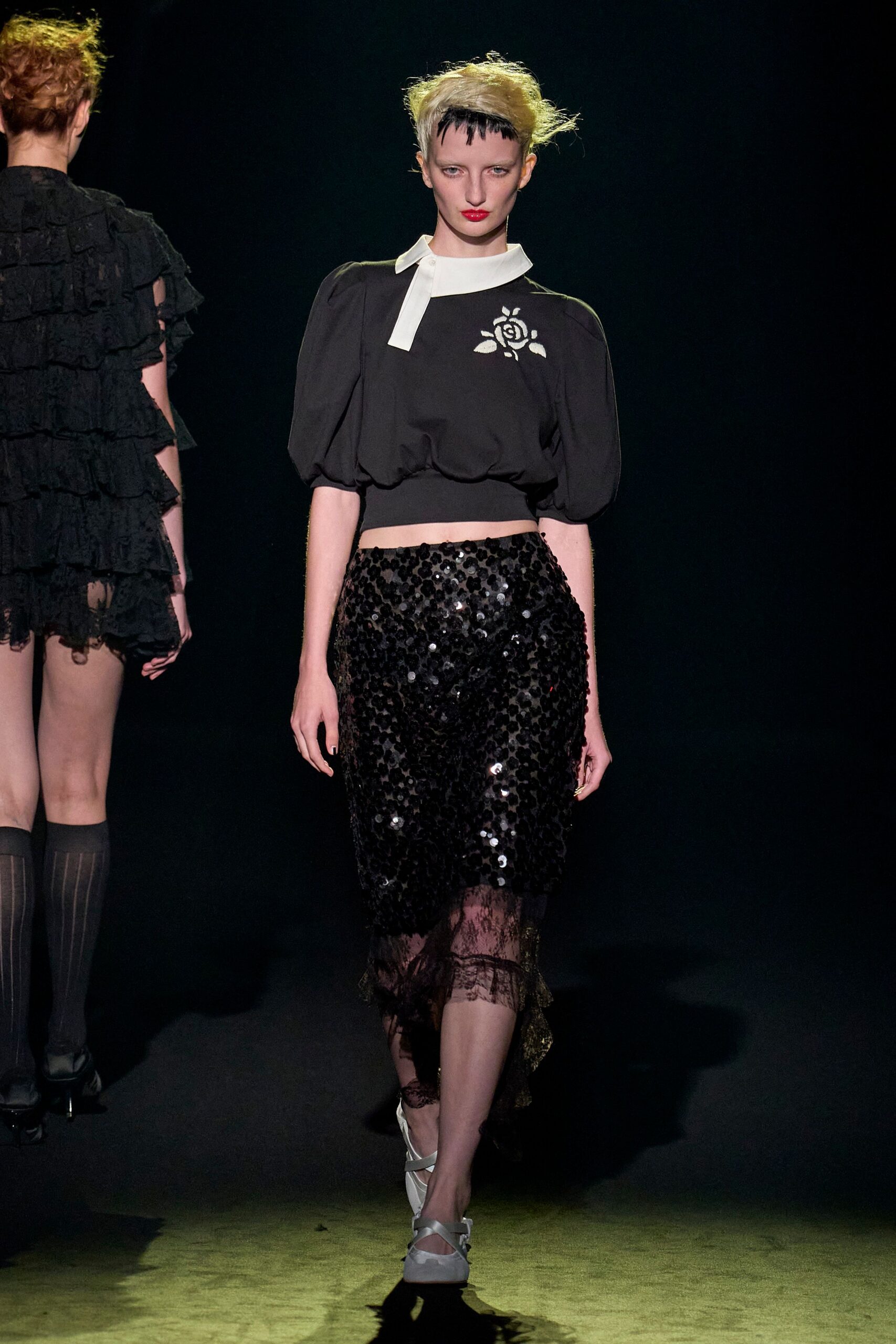 black fitted top and sequined skirt