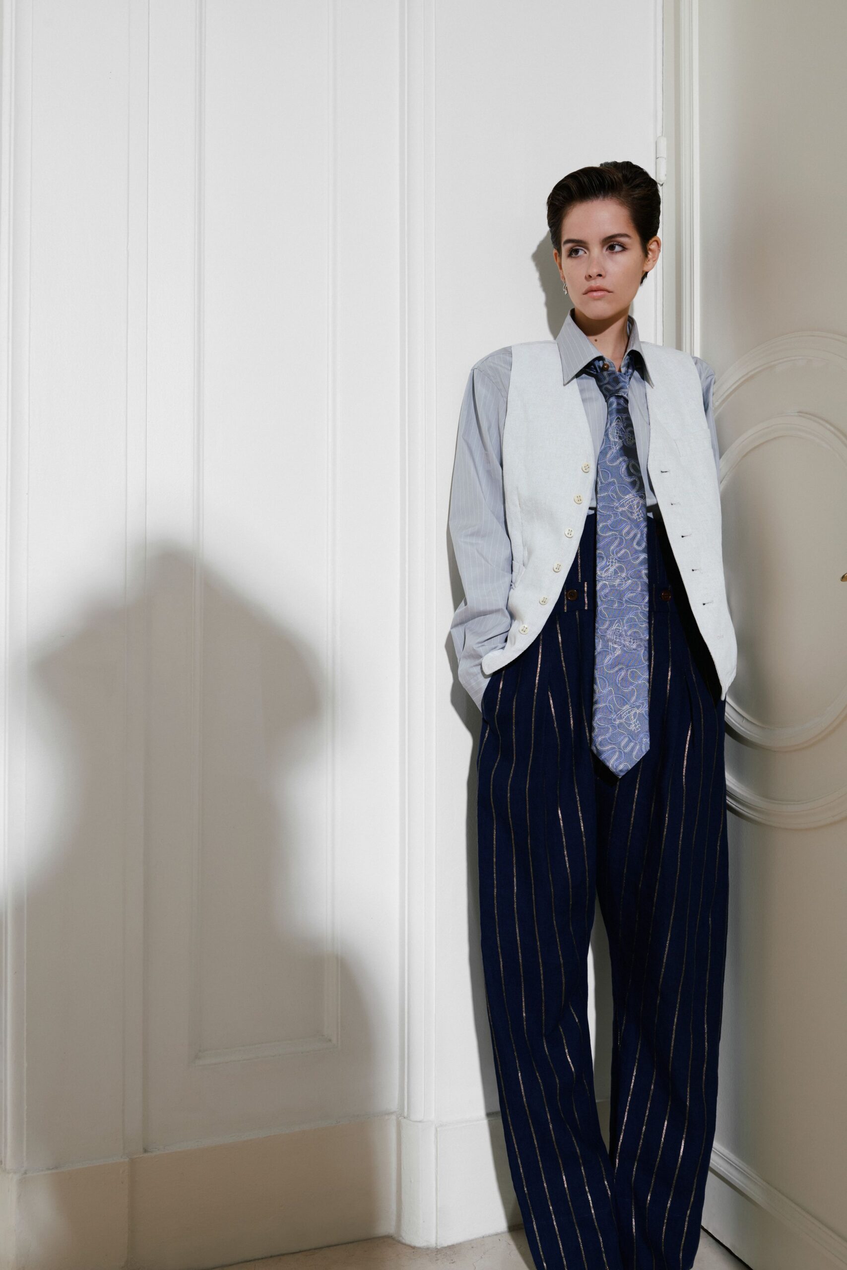 light gray vest with blue shirt