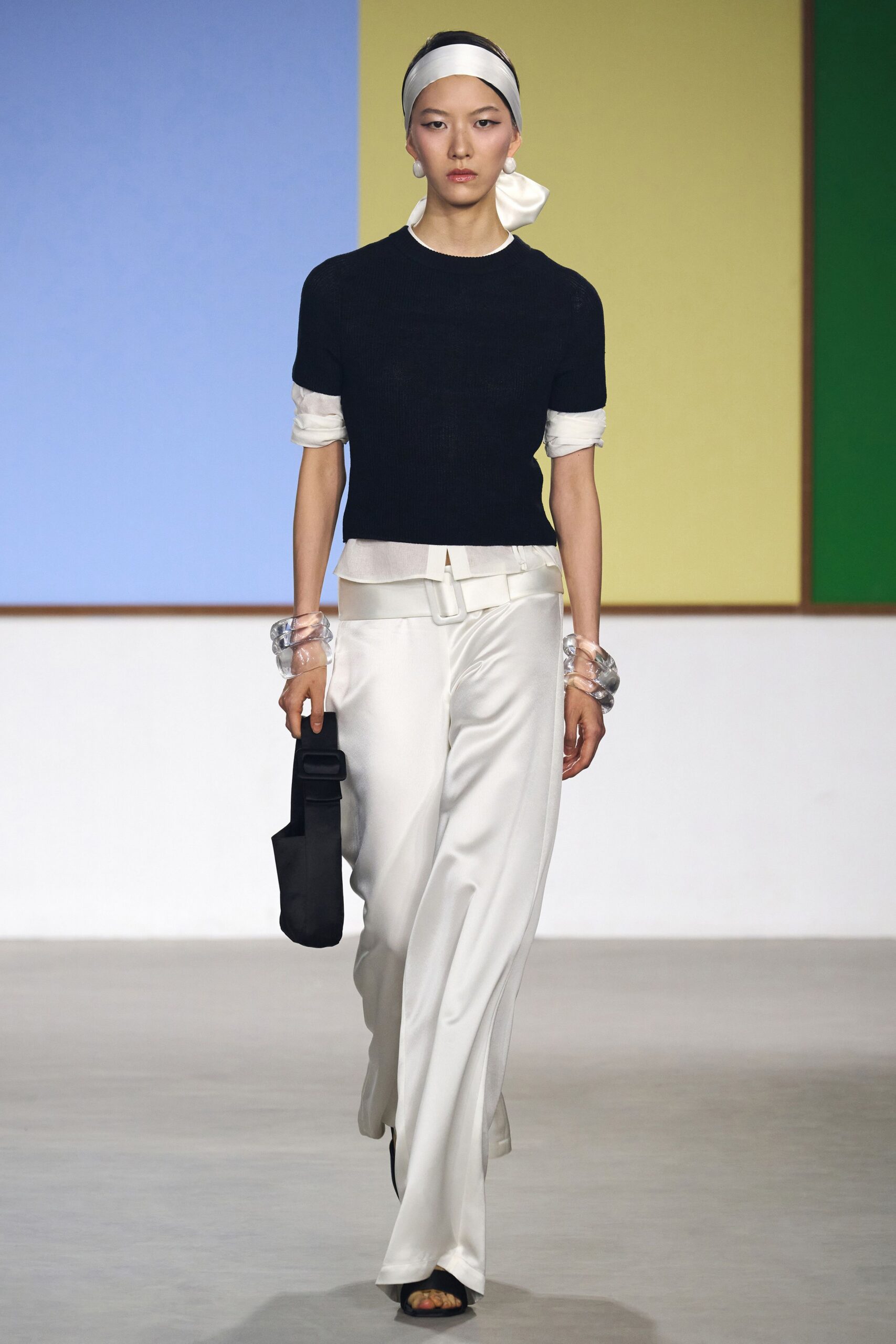 black fitted top and white relaxed pants