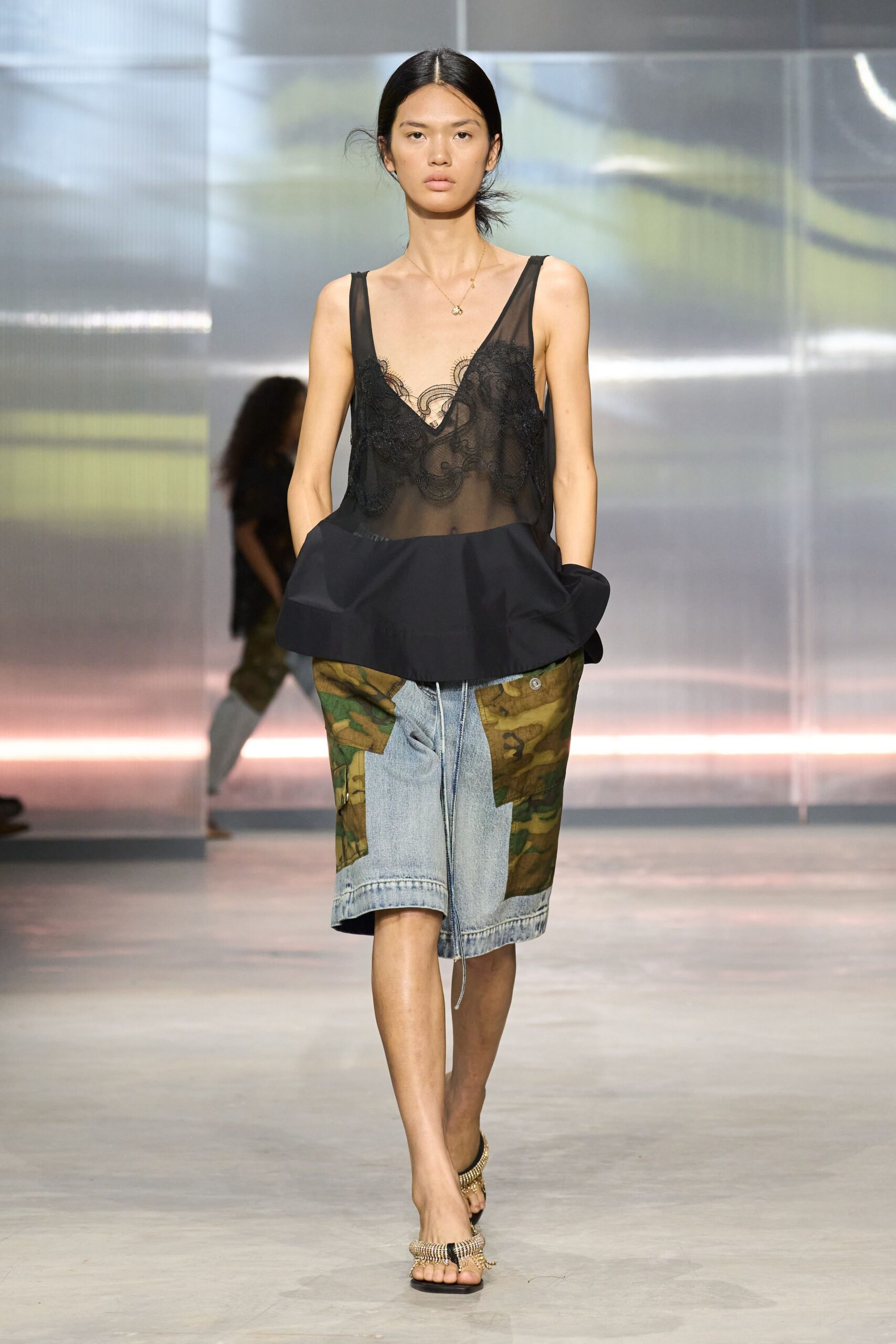 black silk sleeveless top with denim shorts