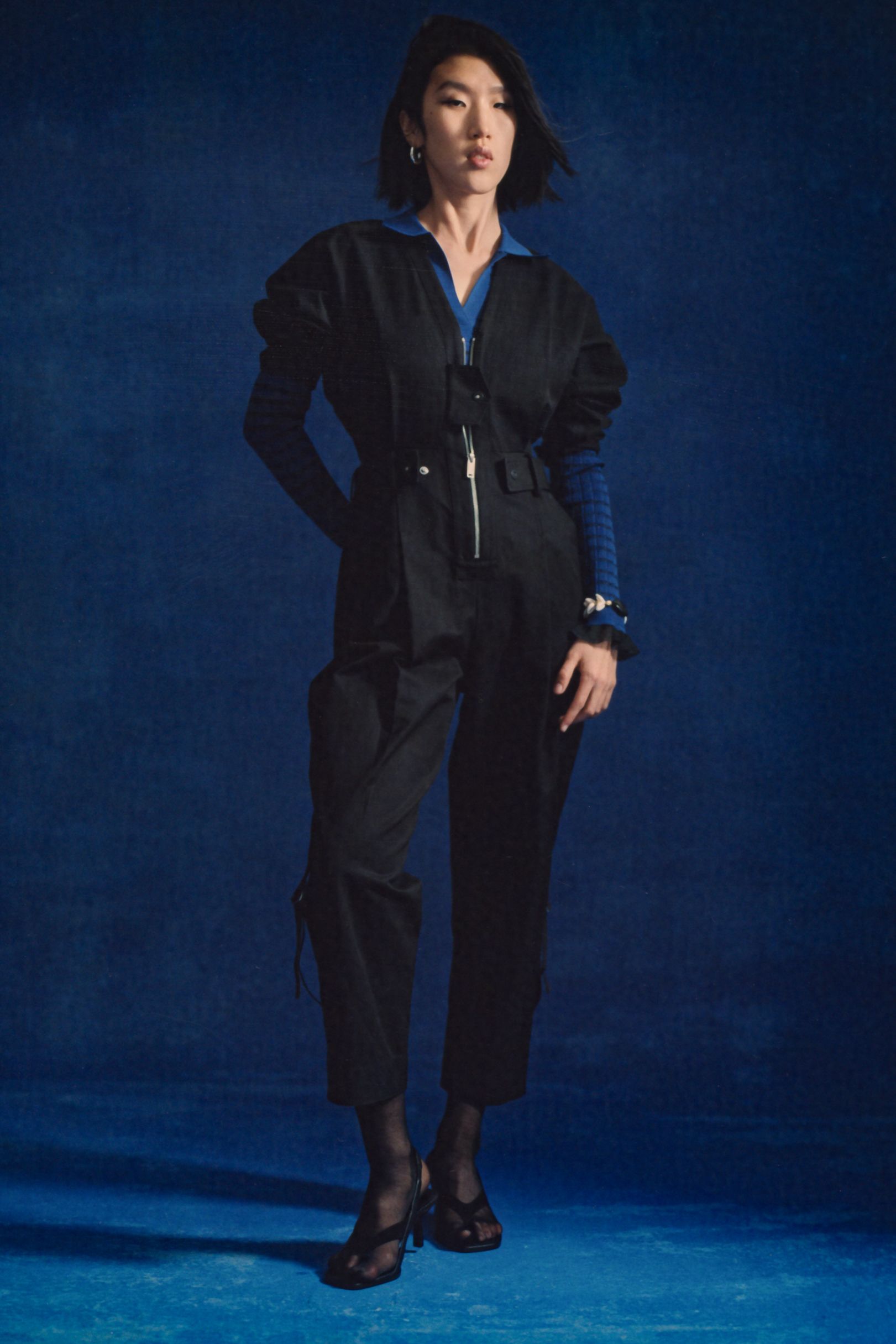 black fitted jumpsuit with heels