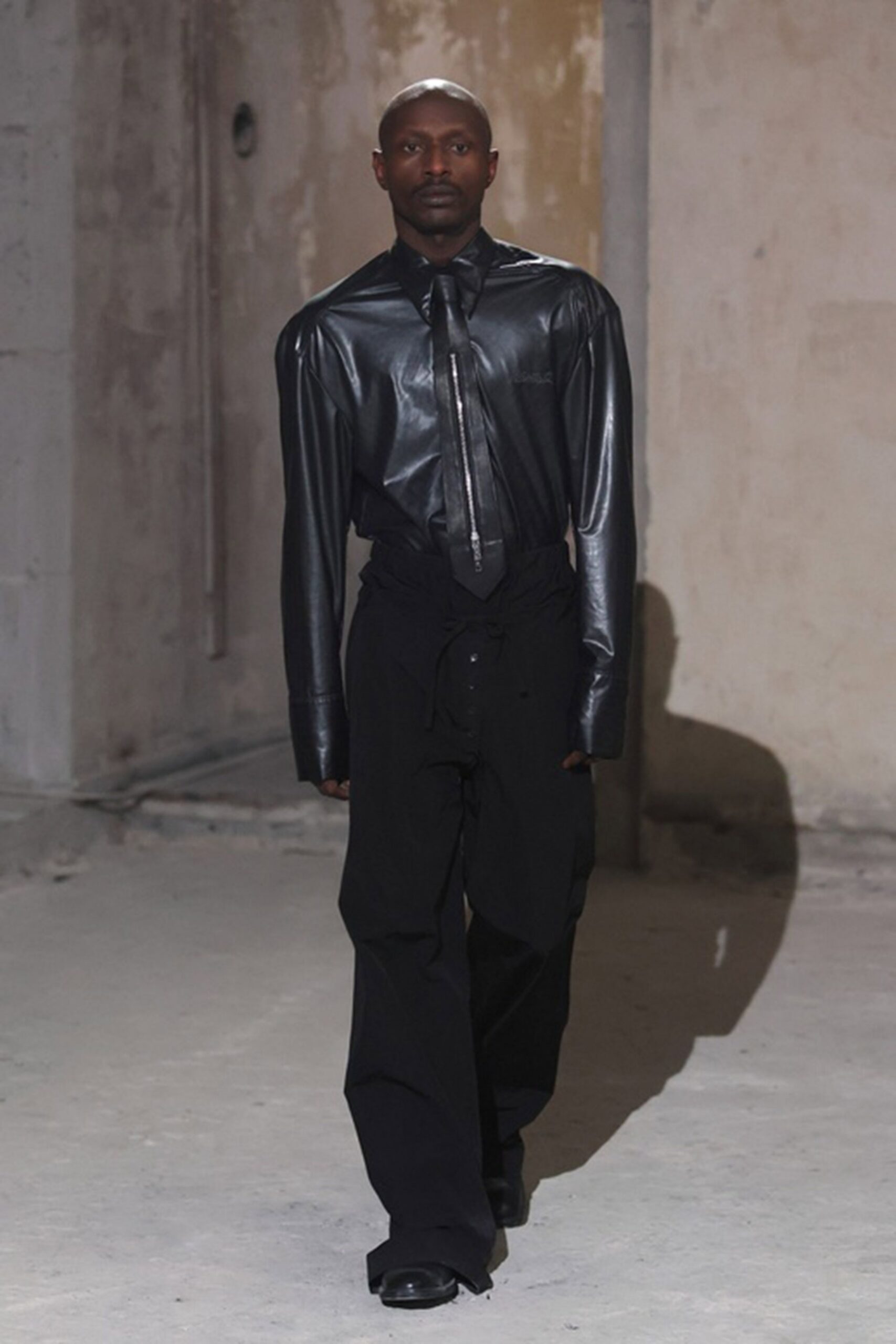 black leather shirt and relaxed pants