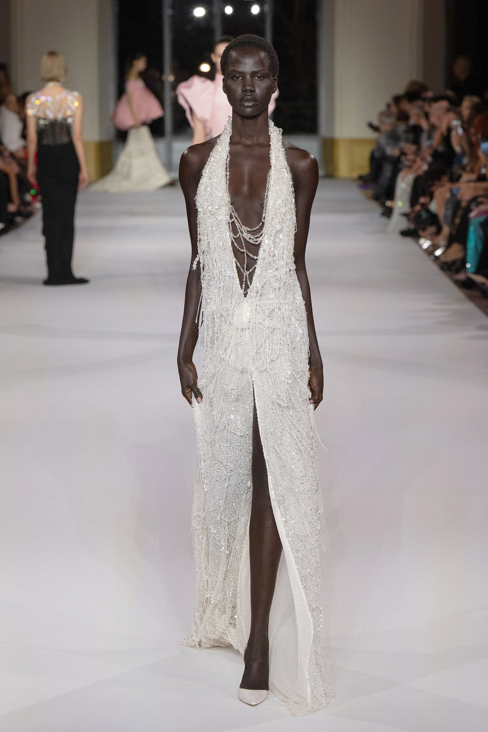 white silk sleeveless v-neck fitted beaded draped gown