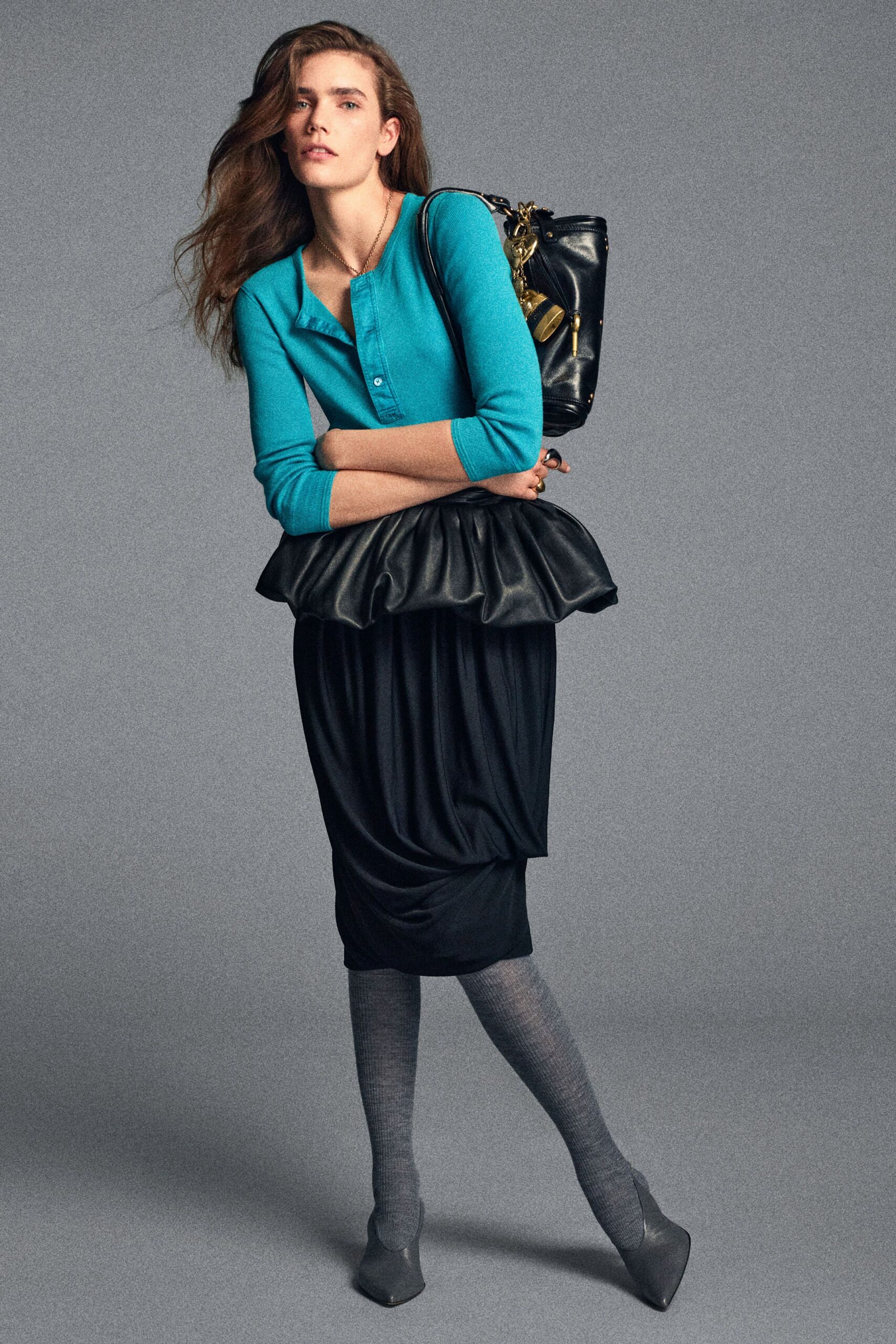 blue fitted top with black skirt