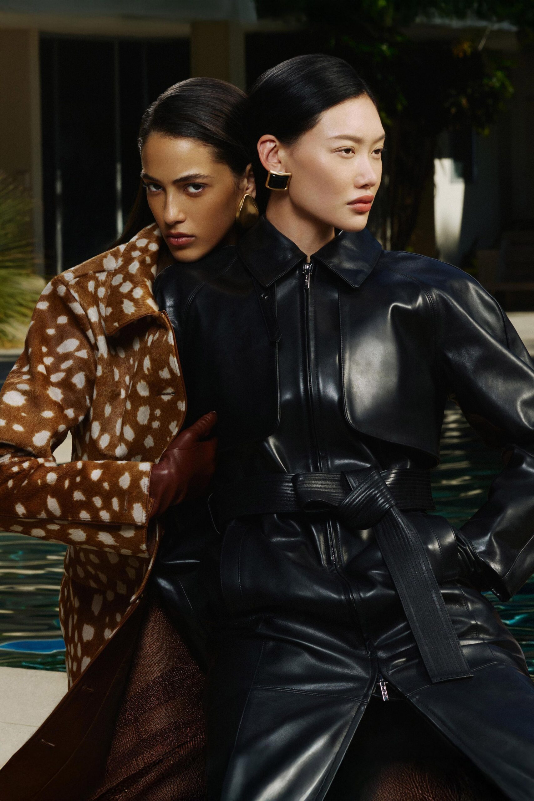 black leather long-sleeve collared fitted zippered belted jacket