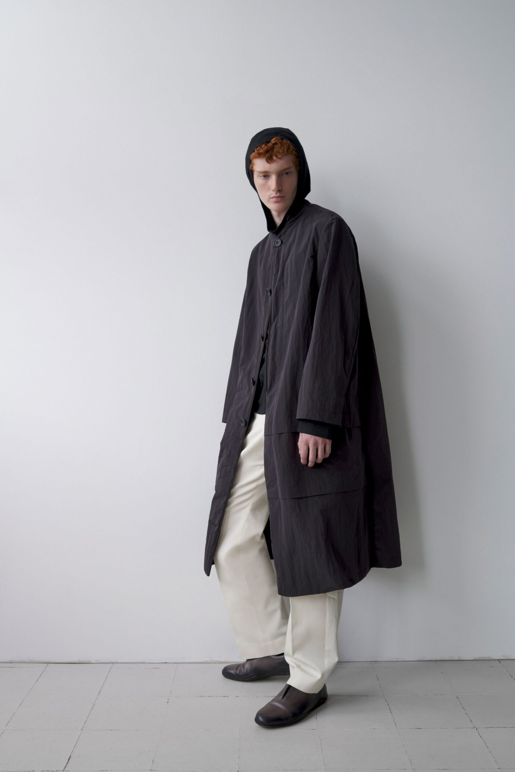 black coat white pants brown shoes