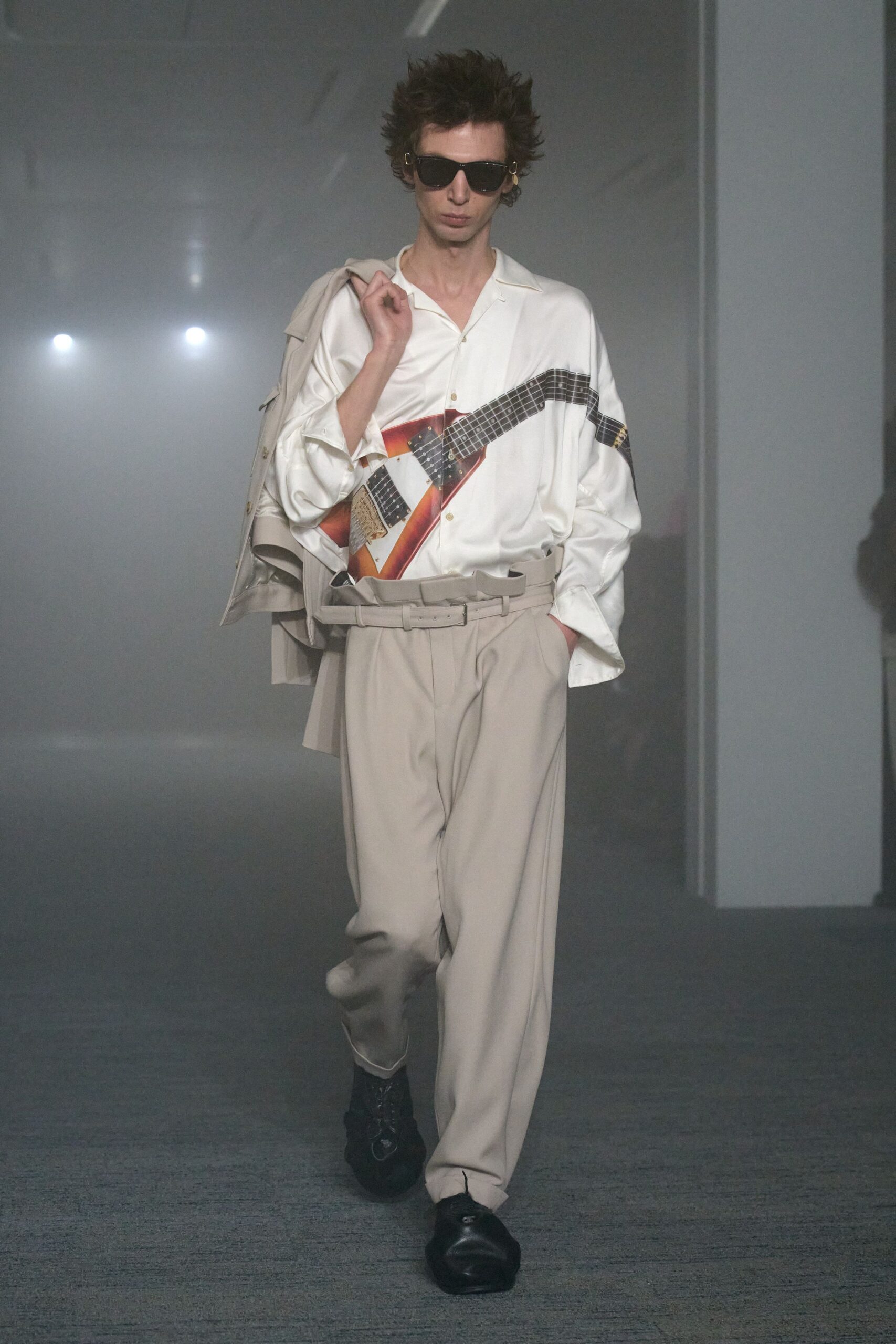 white relaxed shirt beige pants