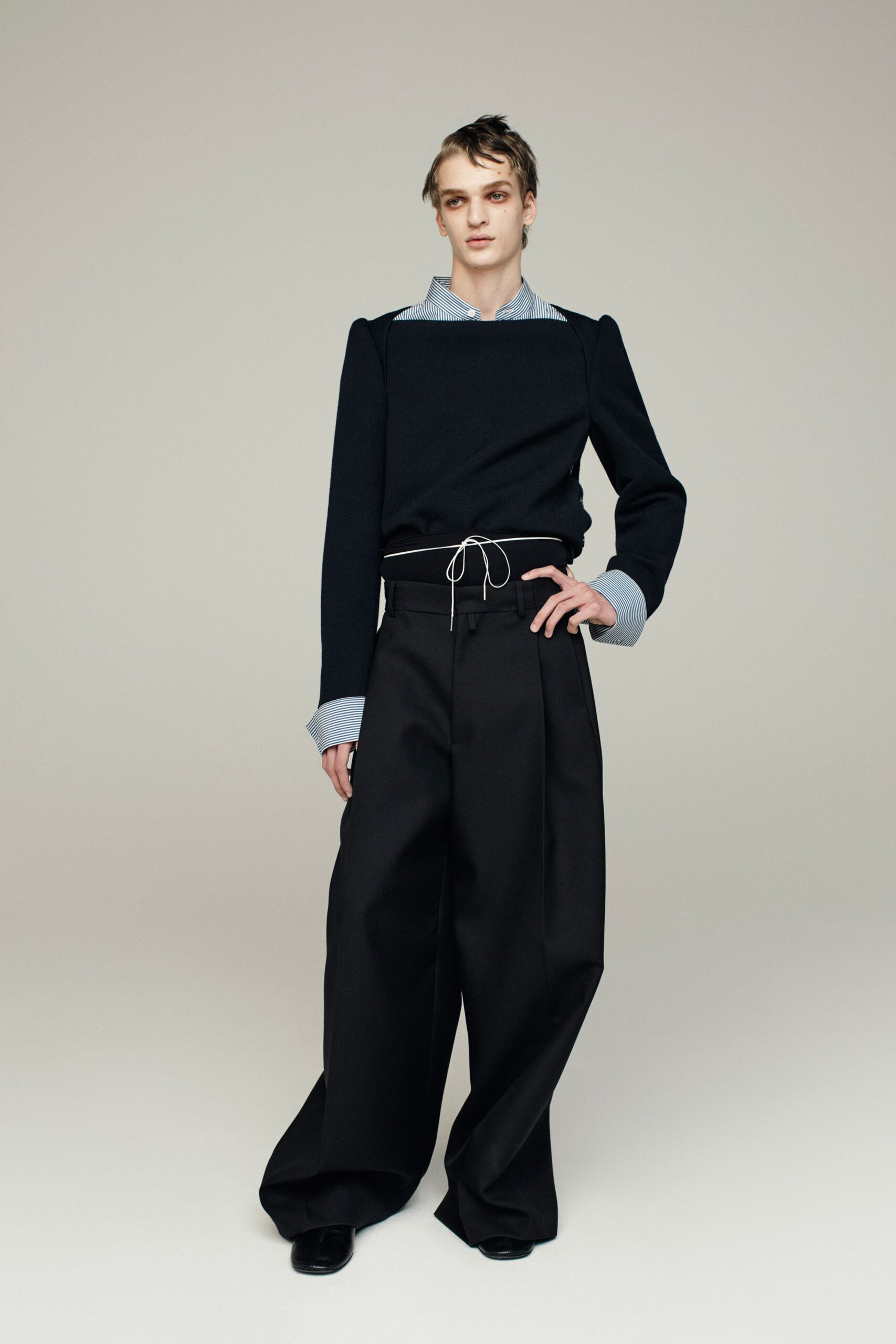 black sweater and wide-leg pants