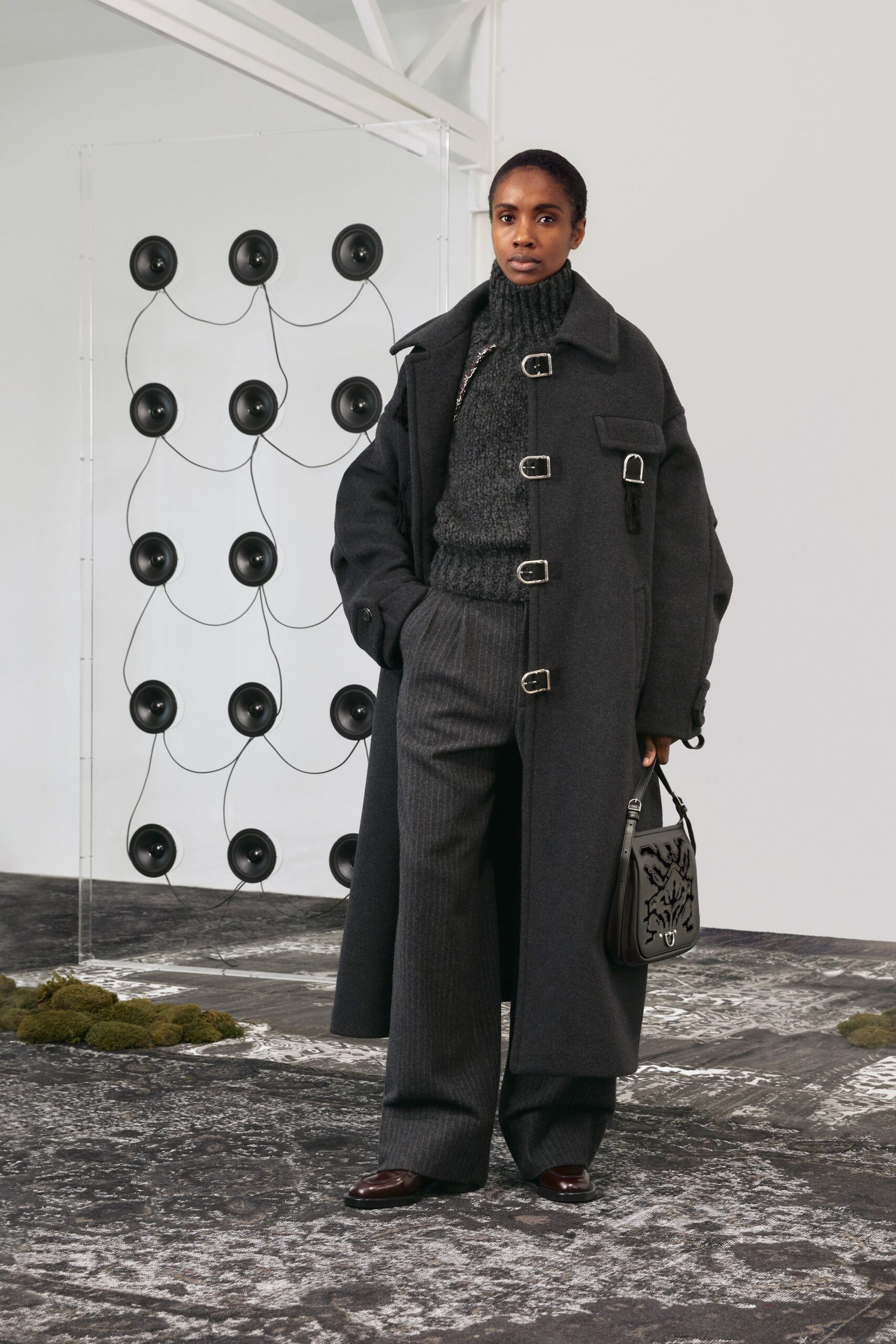 black wool long-sleeve collared oversized zippered coat