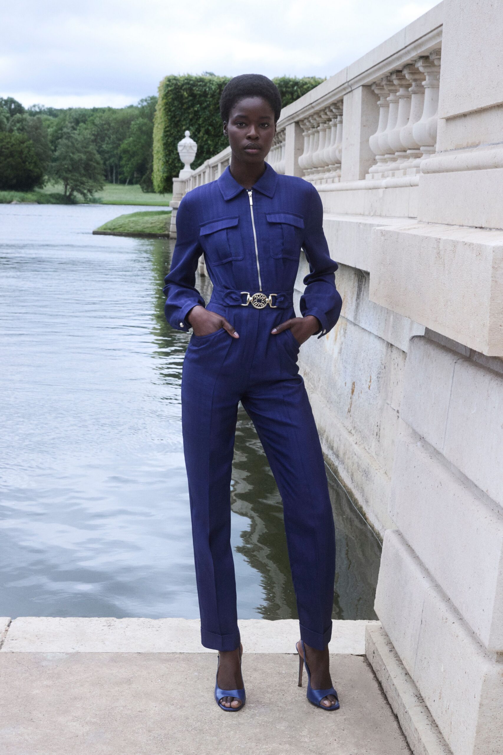blue cotton long-sleeve collared fitted zippered pockets jumpsuit