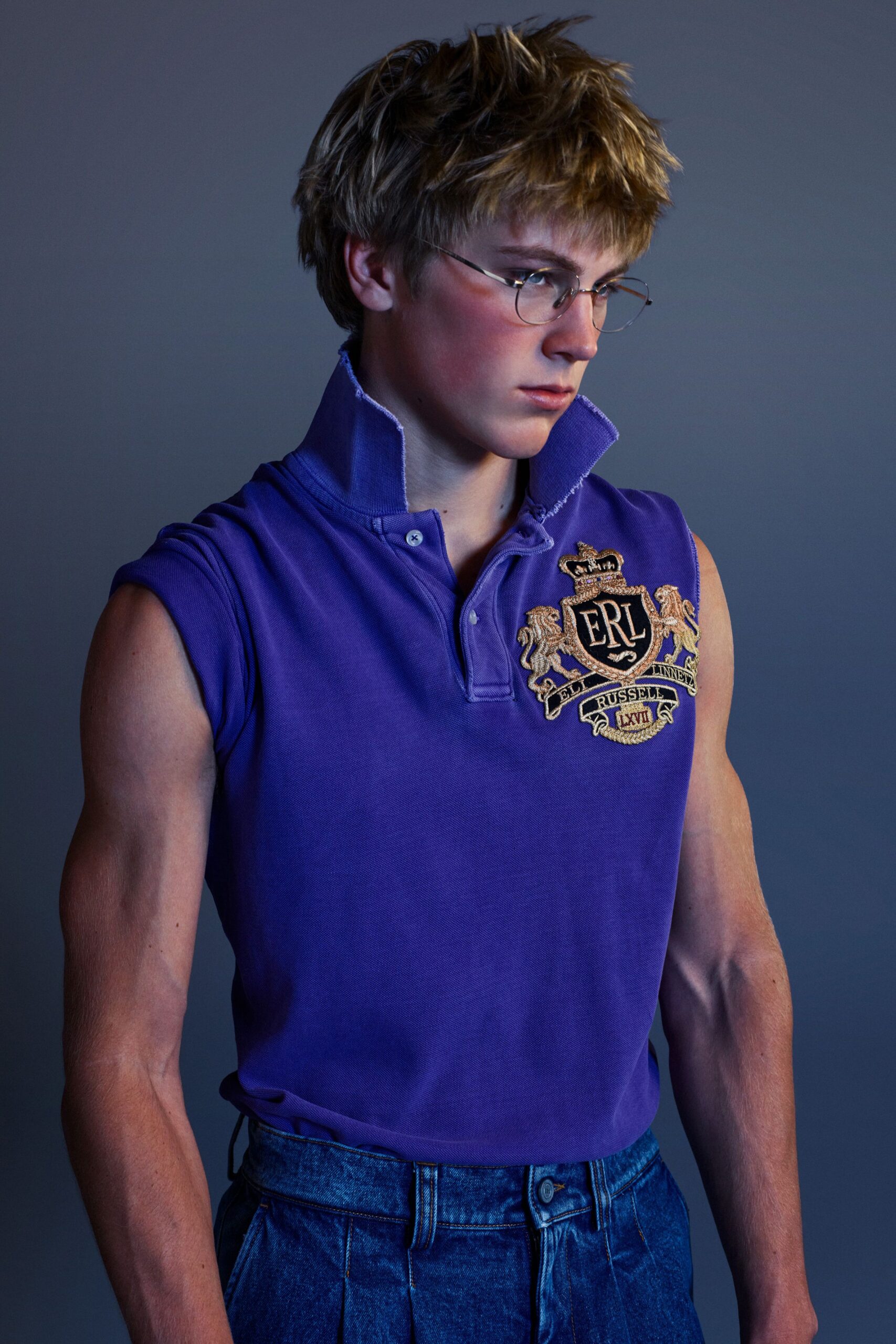 purple collared shirt and blue pants