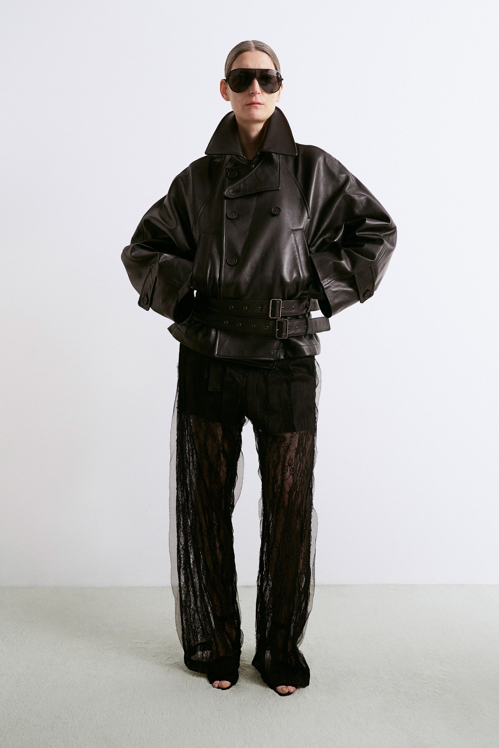 black leather long-sleeve collared oversized zippered belted jacket