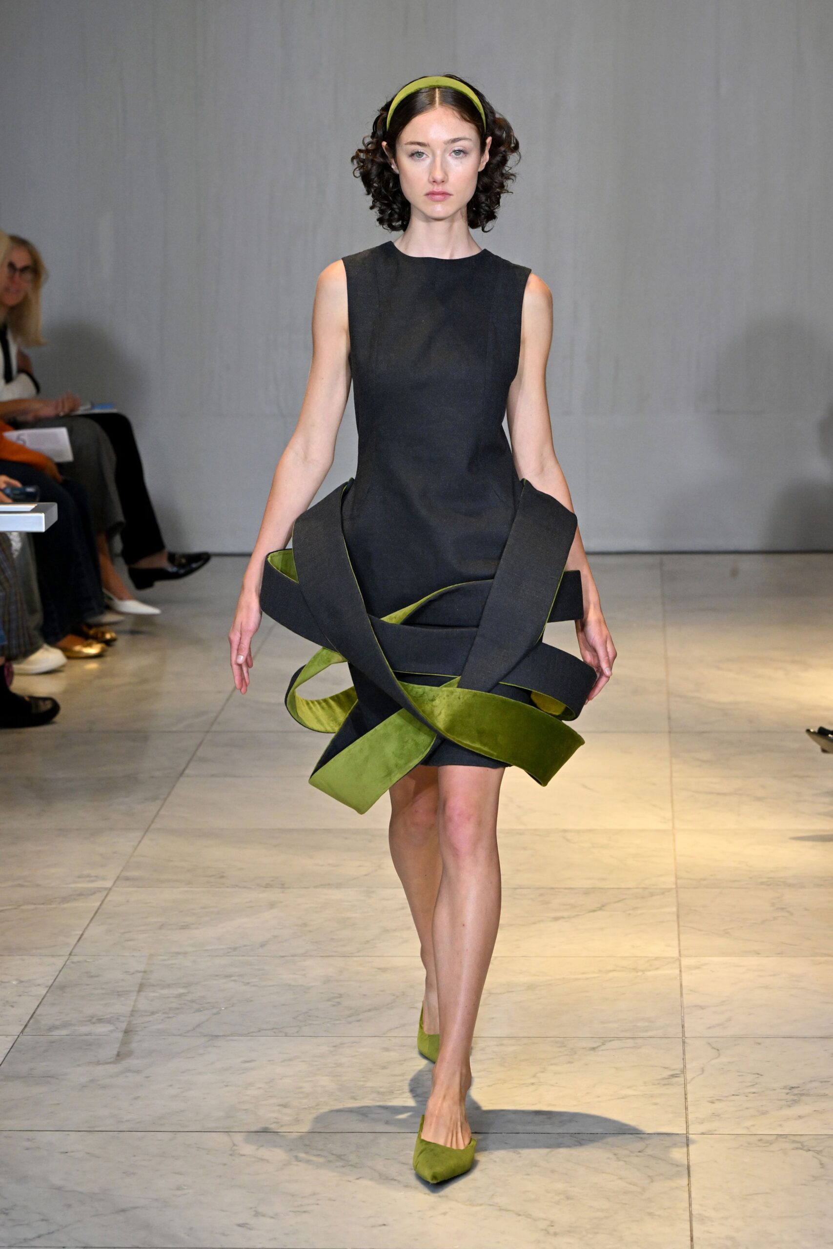 black mini dress with green accents