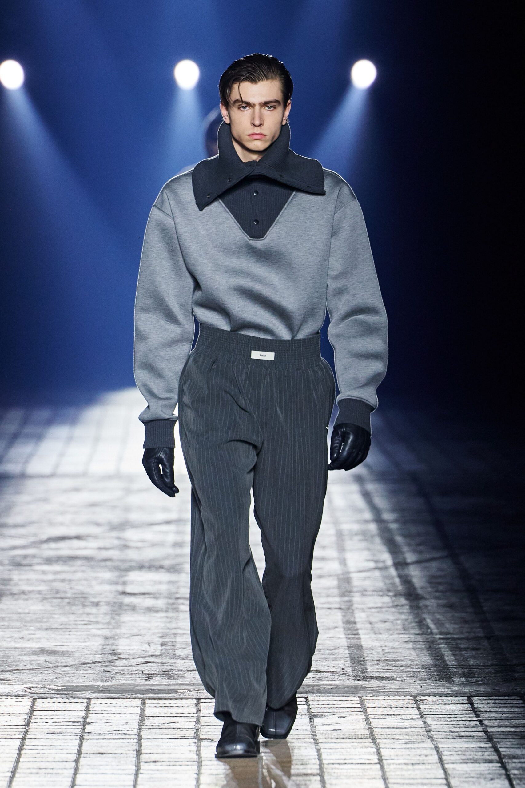 gray relaxed sweater with black tailored pants