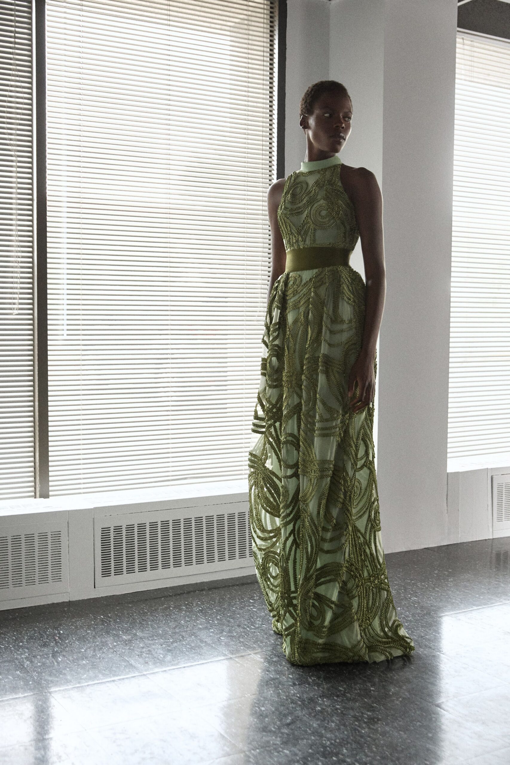 green embroidered sleeveless gown